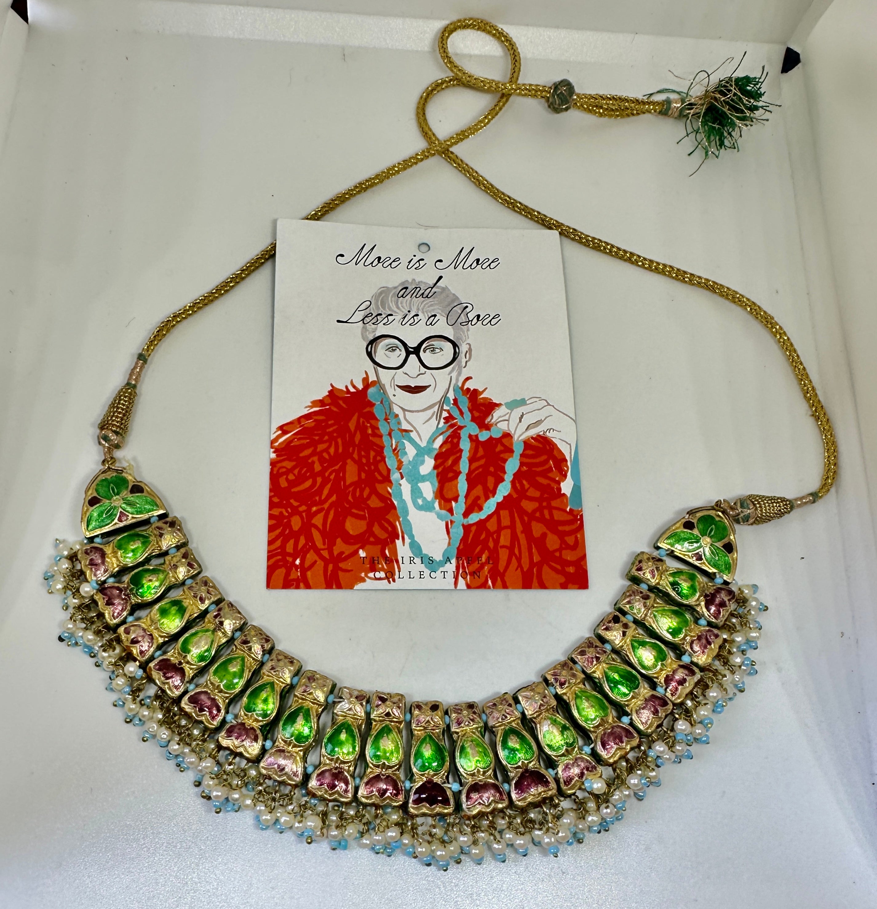 From the personal collection of style icon Iris Apfel we have her Meenakari Indian Heart Motif Necklace with Enamel adornment in vivid colors of greens, reds and blues.  The gorgeous necklace is adorned on both sides.  One side has green and red