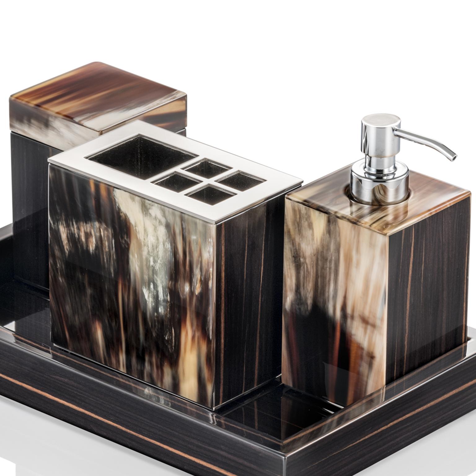 Minimalist yet decorative, the Iris bath set is an must-have complement to an elegant bathroom. Crafted of glossy ebony, the sleek design is embellished by unique inlays in Corno Italiano, boasting dreamy hues. Comprised of a soap dispenser,