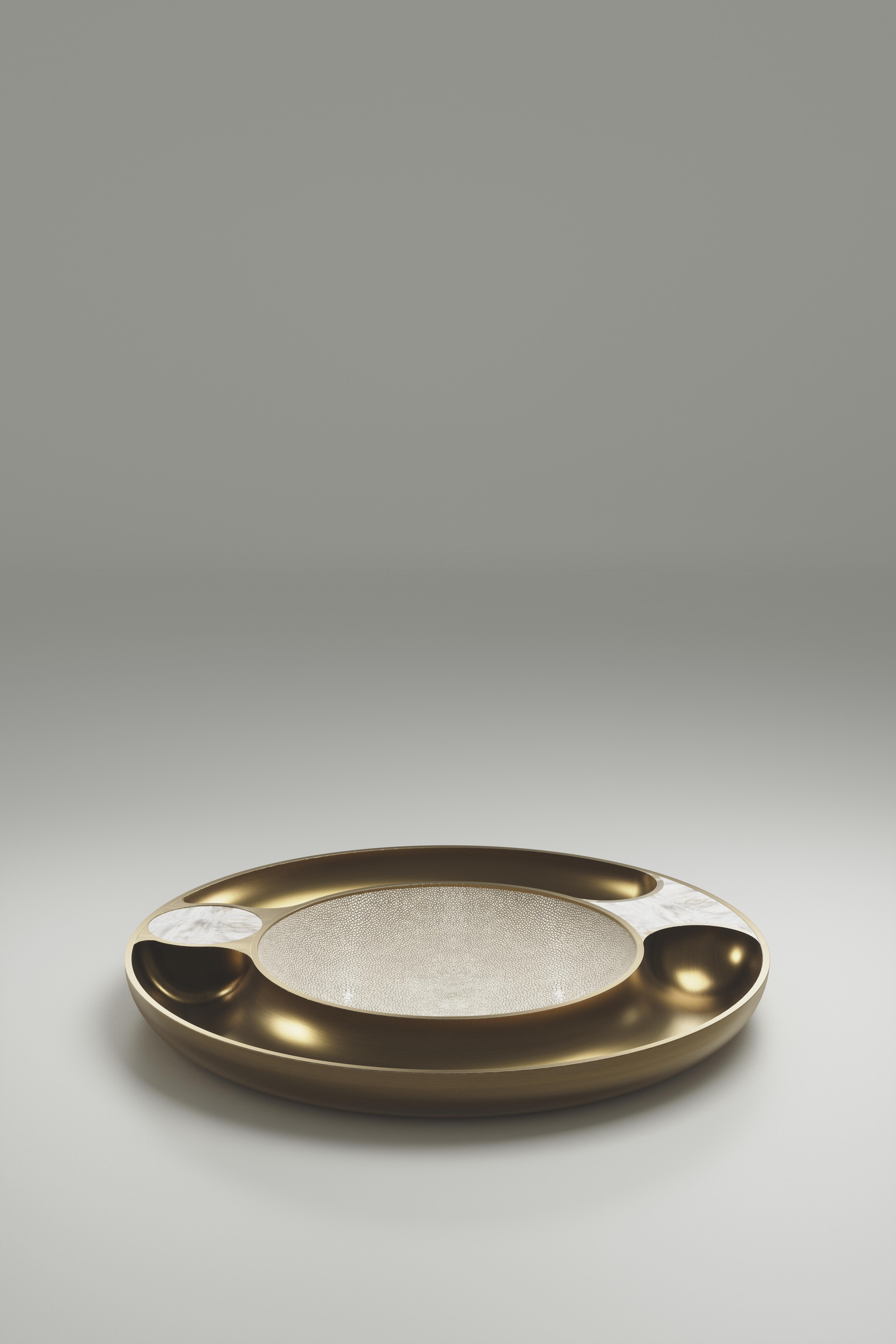 The Iris bowl by R&Y Augousti is an elegant and versatile piece. An abstract interpretation of an eye, the piece is inlaid in cream shagreen, and bronze patina brass. 