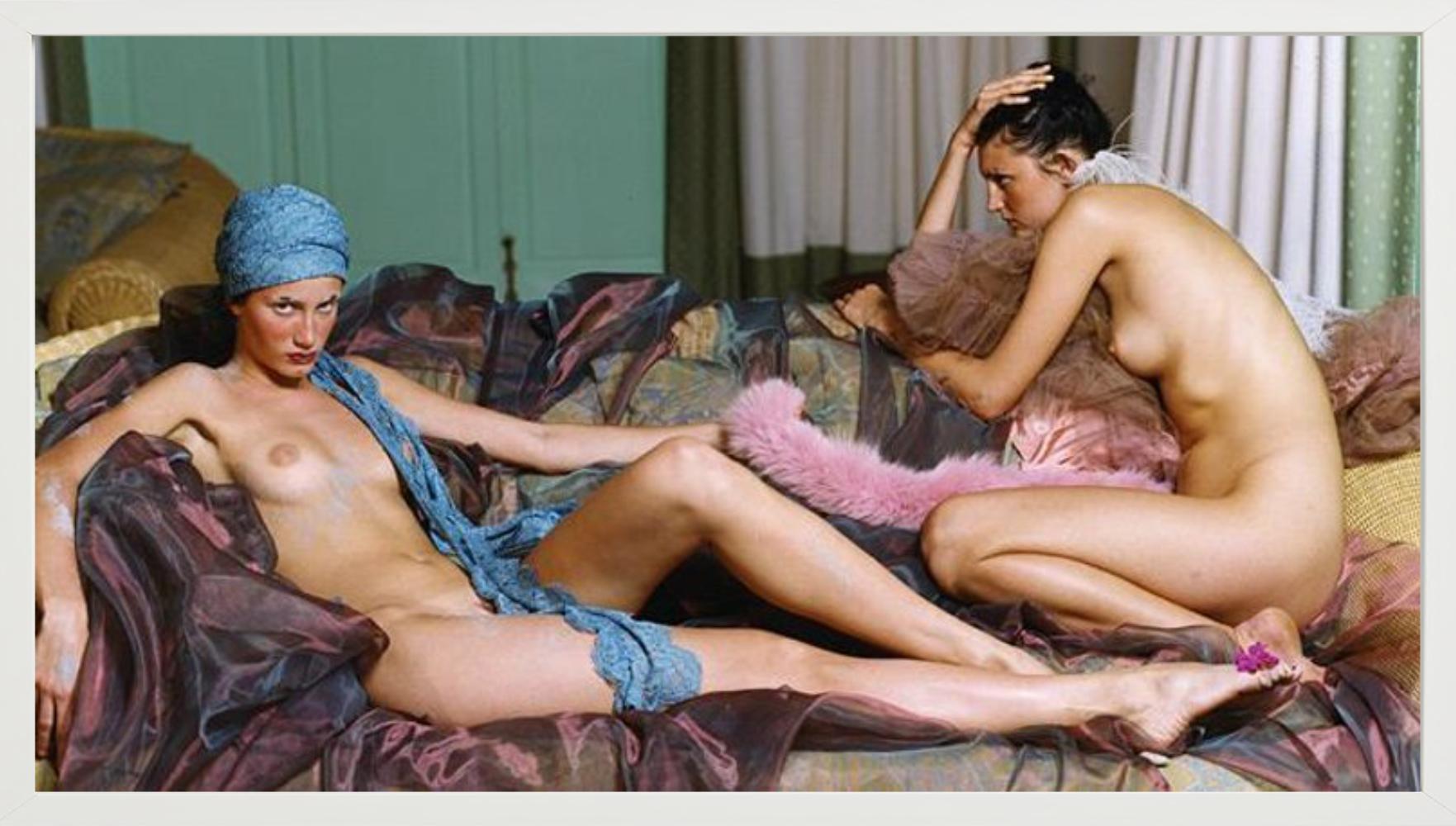 Lanzarote #1 - two nude models posing on a sofa, fine art photography - Photograph by Iris Brosch