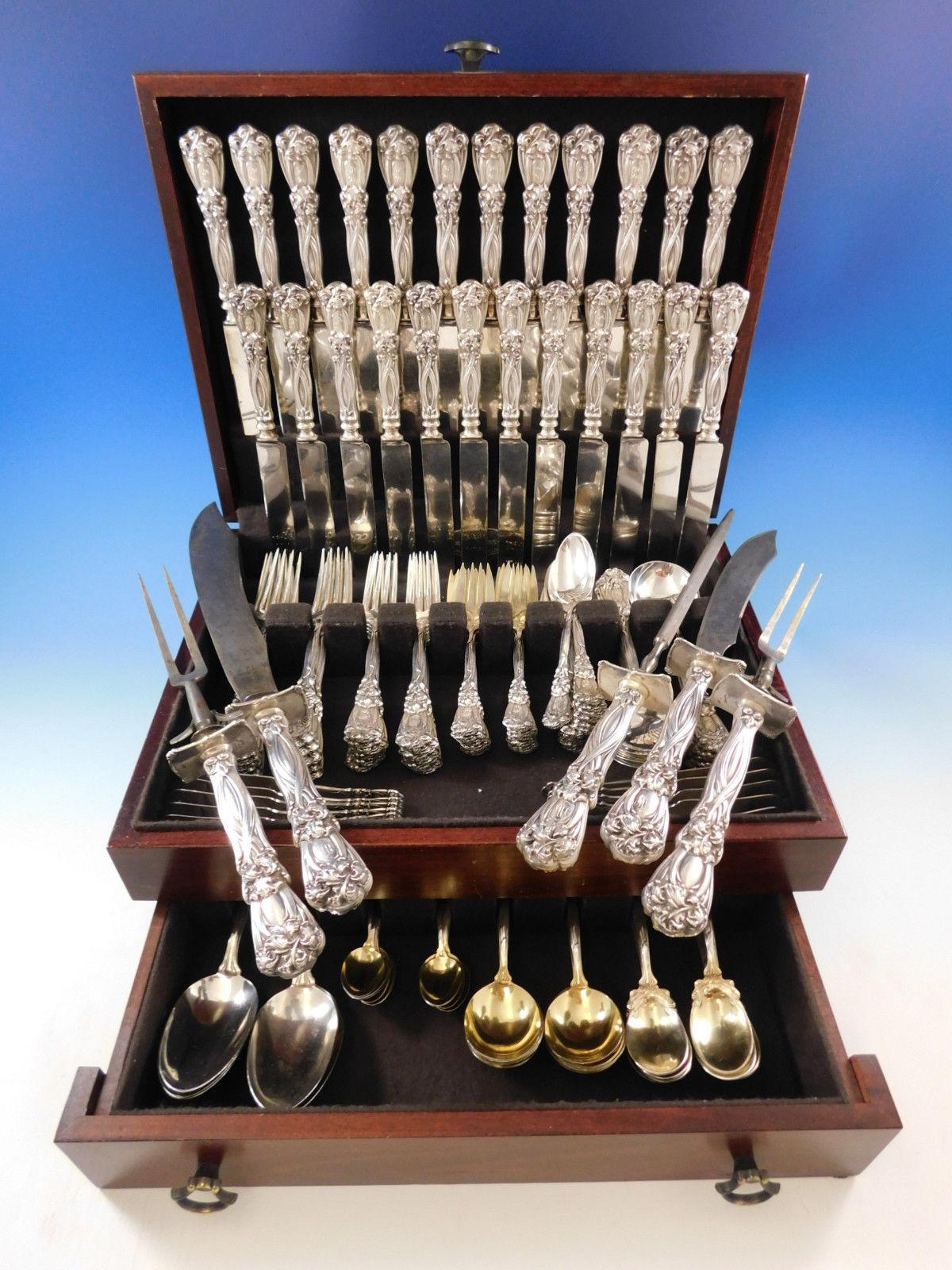 Monumental Art Nouveau dinner and luncheon size Iris by Durgin Sterling silver flatware set, 143 pieces. Iris by Durgin-Gorham is lavishly decorated and wonderfully heavy, circa 1900. 

This set includes:

12 dinner size knives with blunt