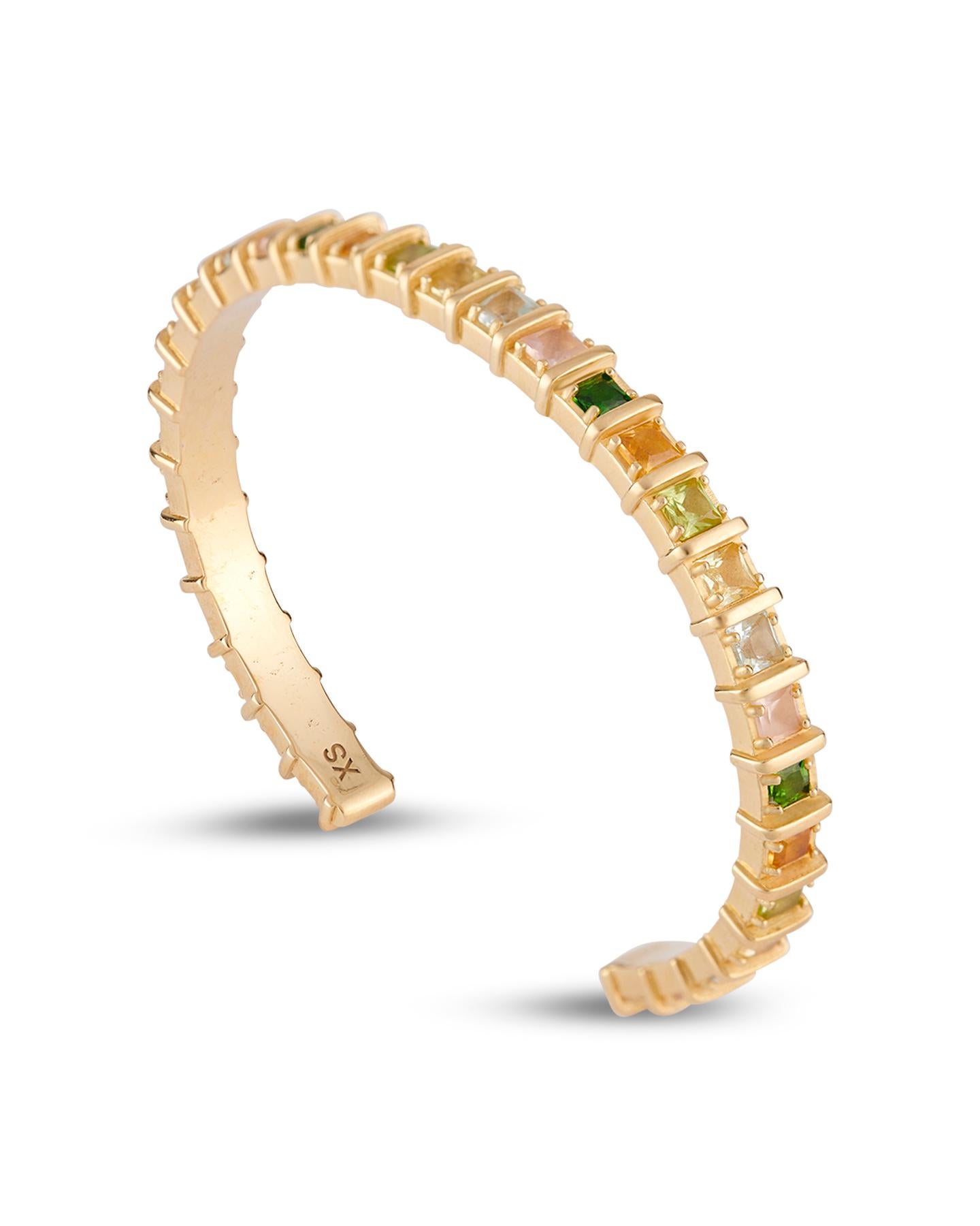 The gold-plated Iris cuff is set with multicolored natural gemstones encased in raised, squared frames. Designed with a delicate open band, this piece stacks perfectly with similar styles in the collection.

Details:
925 Sterling Silver
Plated in
