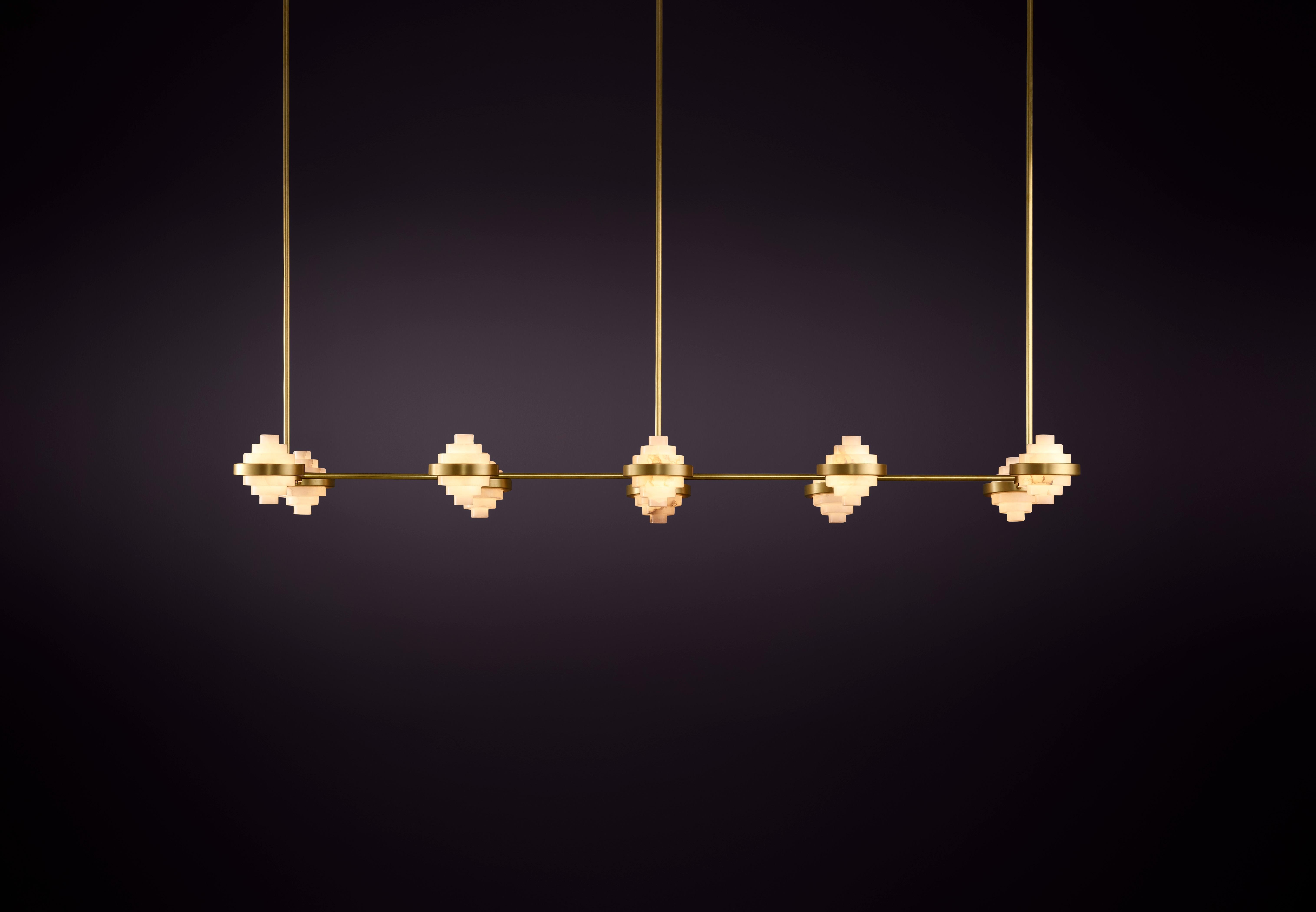 Iris Deca Linear Array Pendant Light by Christopher Boots
Dimensions: D 60 x W 152 x H 12 cm.
Materials: Brass, alabaster.

Available in Aged Brass, Brushed Brass, Hand Rubbed Brass, or Dark Bronze Please contact us.

The IRIS collection encompasses