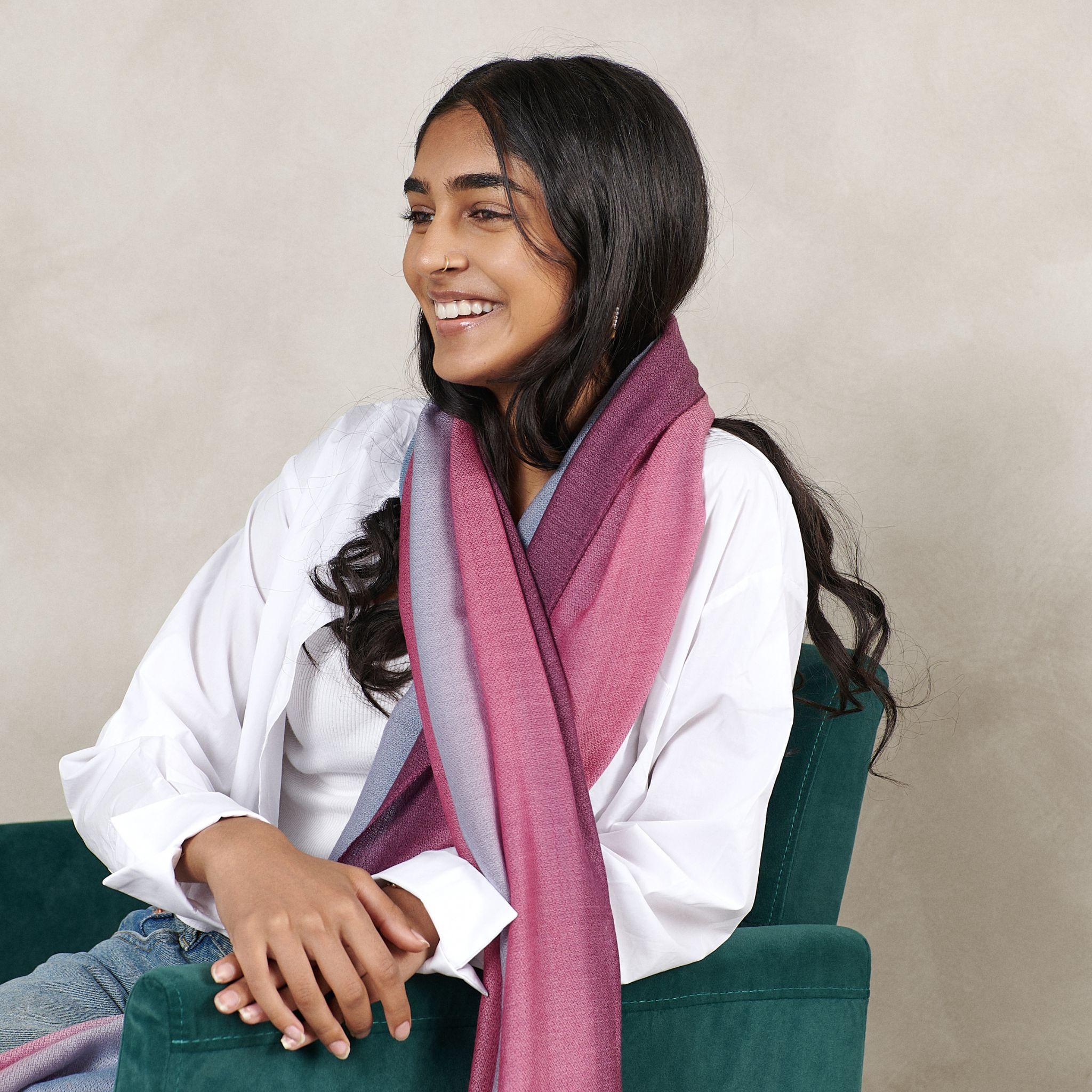 Combining simplicity & elegance with artistic luxury, Iris Haze Scarf has been carefully dyed by master artisans to give this beautiful one of a kind effect of colors blending. The fine micro diamond weave texture of merino & cashmere add value to