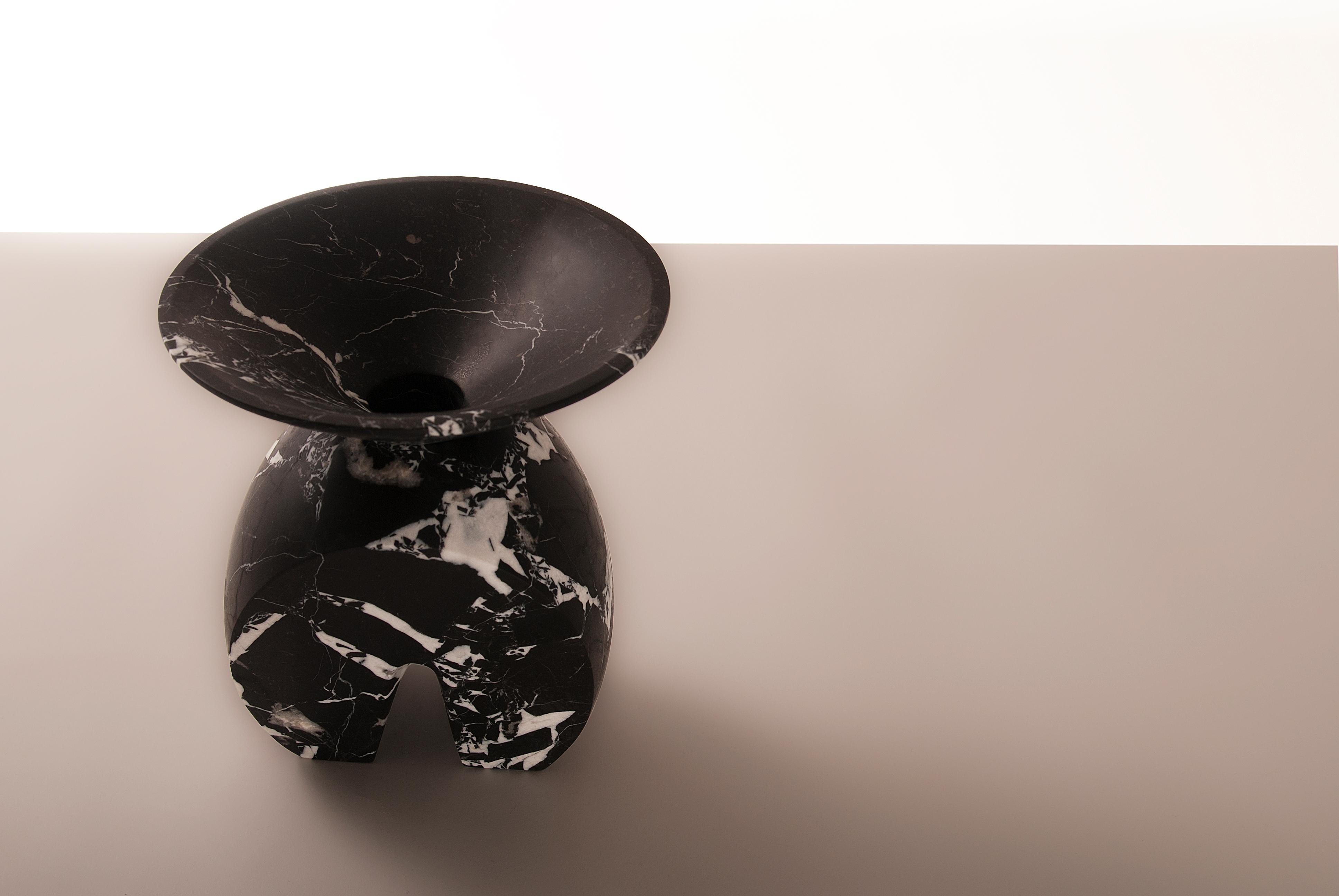Iris, marble contemporary vase, Valentina Cameranesi
Materials: Noir antique black marble (Also available in White Carrara)
Dimensions: 26 x 24 x 24 cm.

The “Avalon” series consists of 3 sculptural vases, made of White Arabescato marble or