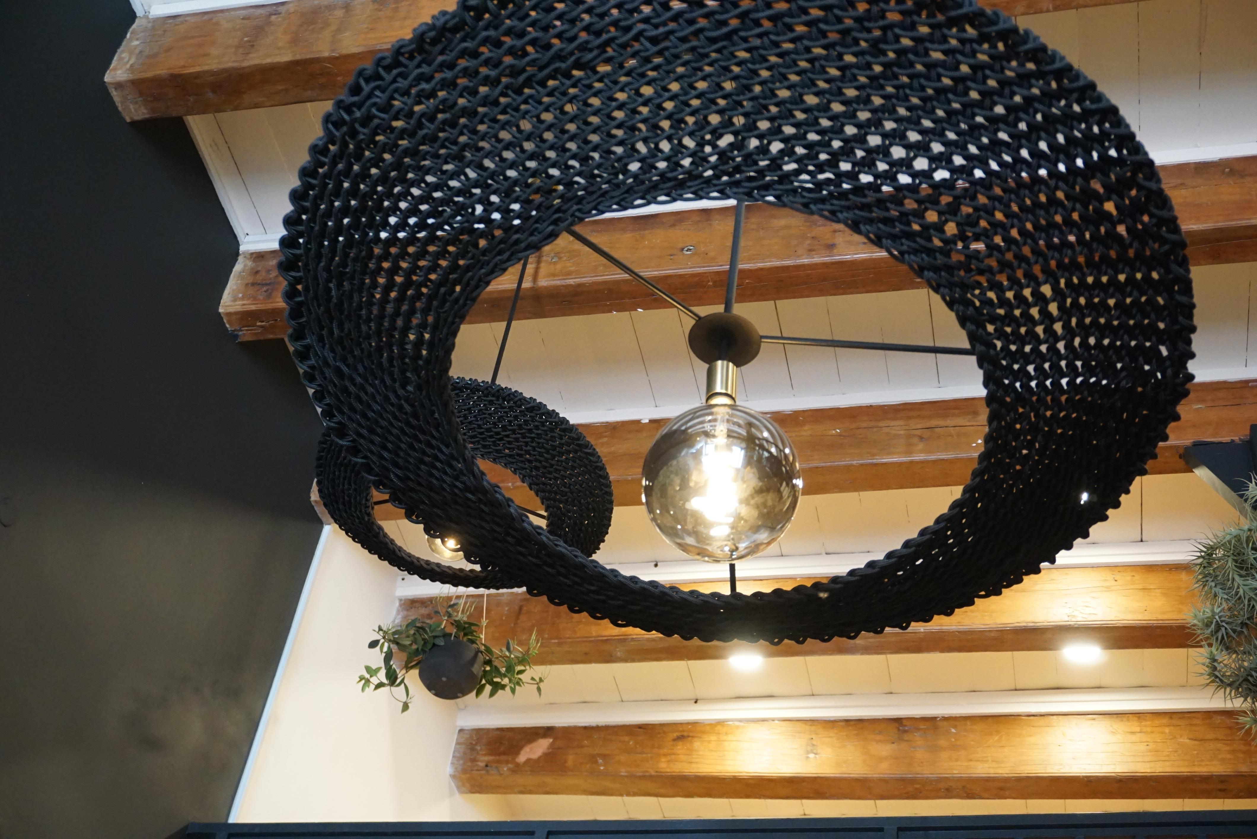 The Iris Pendants. They can be ordered individually or in clusters of different sizes. All Iris pendants are made out of a round steel frame, the Studio Lloyd signature multifilament rope, handcrafted crochet body & LED bulbs. The electrical