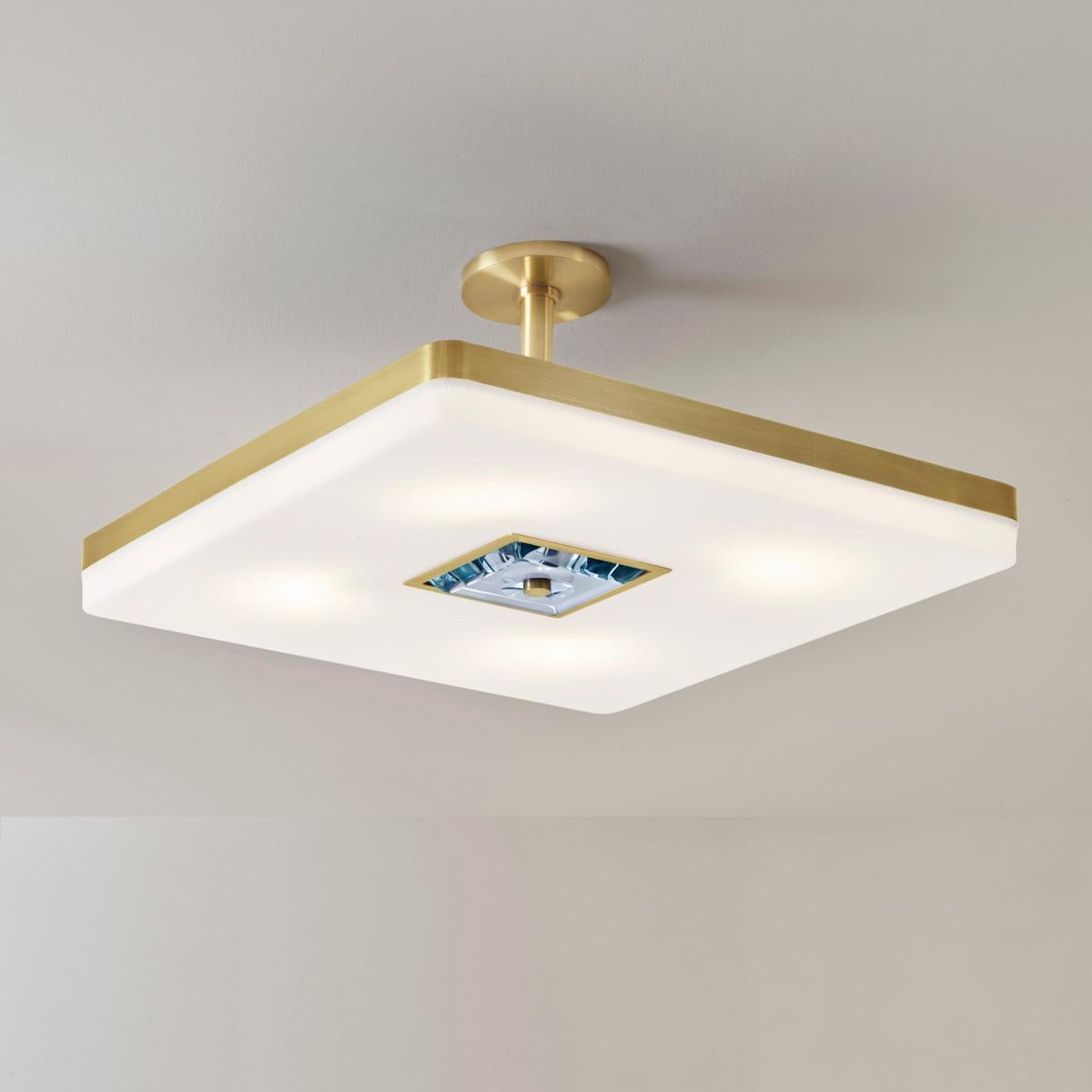 The Iris Square ceiling light is designed around an expansive acrylic shade with a hand carved glass center reminiscent of a gemstone. This versatile fixture can be installed as a pendant on a stem or as a flush mount. Can be used with the Iris
