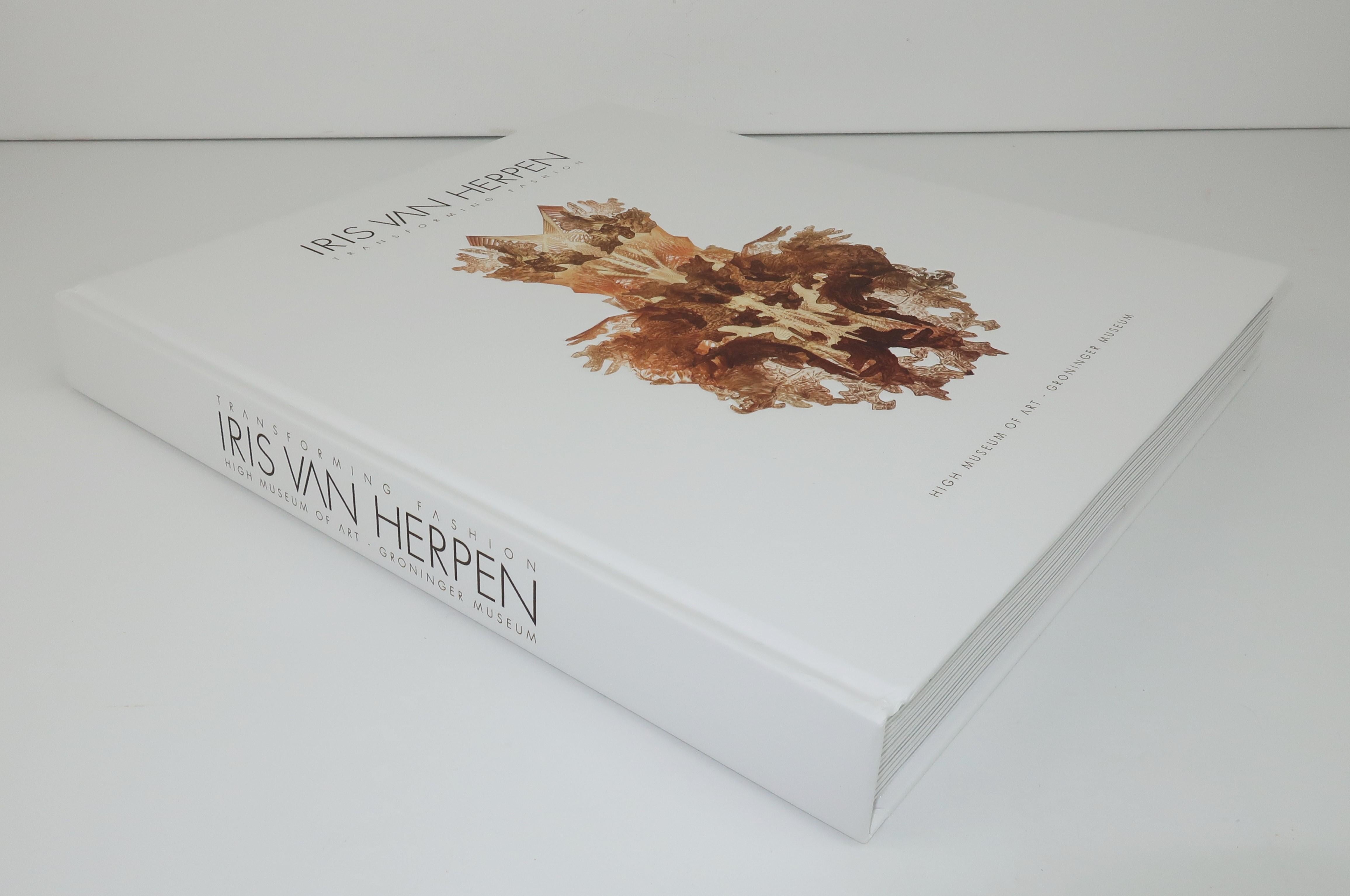 Welcome to the fascinating world of Dutch fashion designer, Iris Van Herpen.  This 392 page hardbound book entitled 'Transforming Fashion' was published in 2015 by The Groninger Museum and Atlanta's High Museum of Art to commemorate an exhibit of