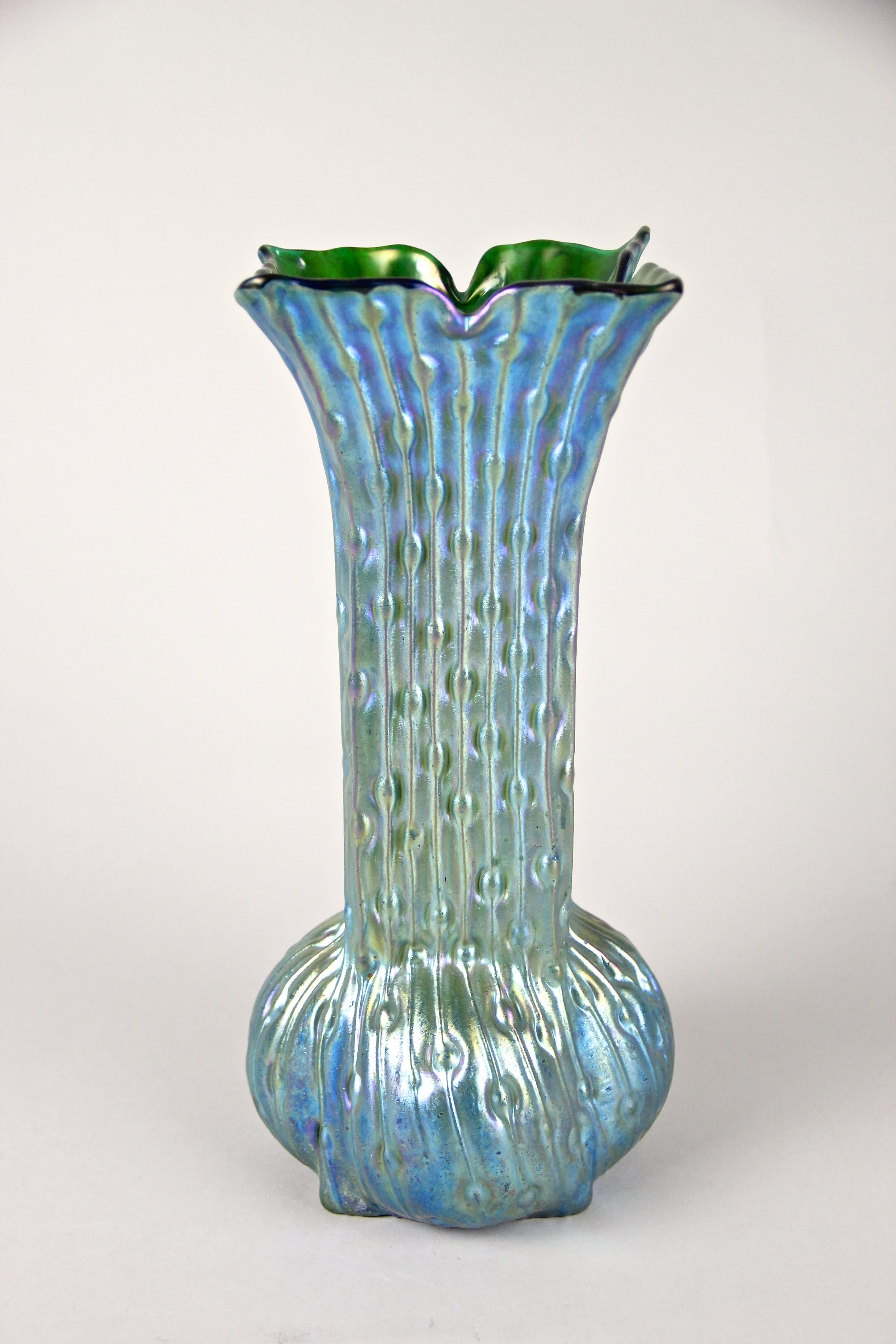 Exceptional Art Nouveau glass vase by Loetz Witwe Klostermuehle, Bohemia, circa 1902. This absolute rare, iriscident Loetz vase shows an unusual shaped body with a beautiful green glass base. The extraordinary decoration, reminding on the 