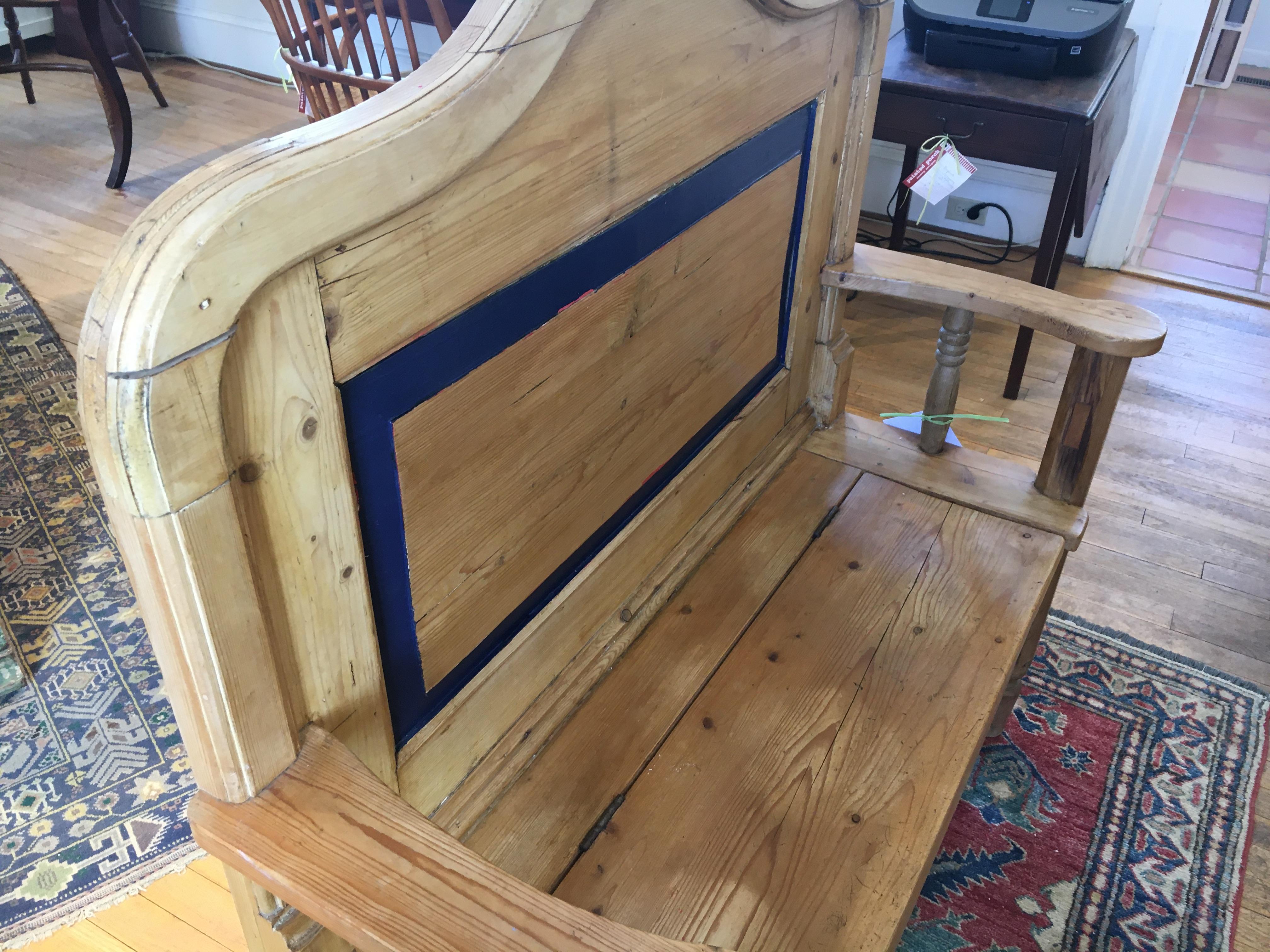 We love Irish pine pieces and this sweet bench has wonderful dimensions and a blue paint accent on the base and back. This would be perfect in a hallway or entrance to take off your boots. The arms and back have wonderful lines.