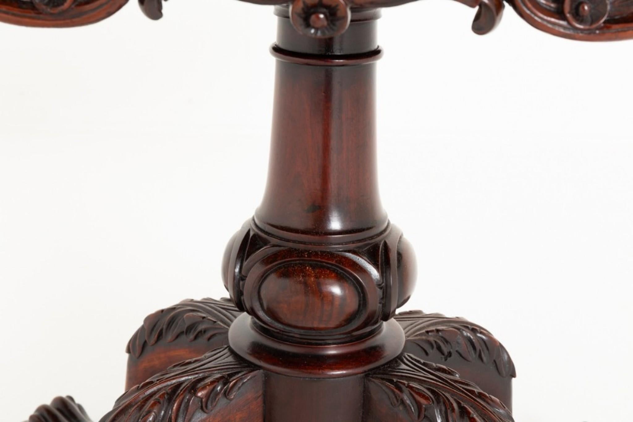 This Impressive Mahogany Irish Card Table Stands Upon Swept Legs with Carved Knees and Carved Lions Paw Feet.
Circa 1860
The Turned Column Having Carved Lozenges.
The Frieze of the Card Table Having a Carved and Further Carved Decoration.
The Top of