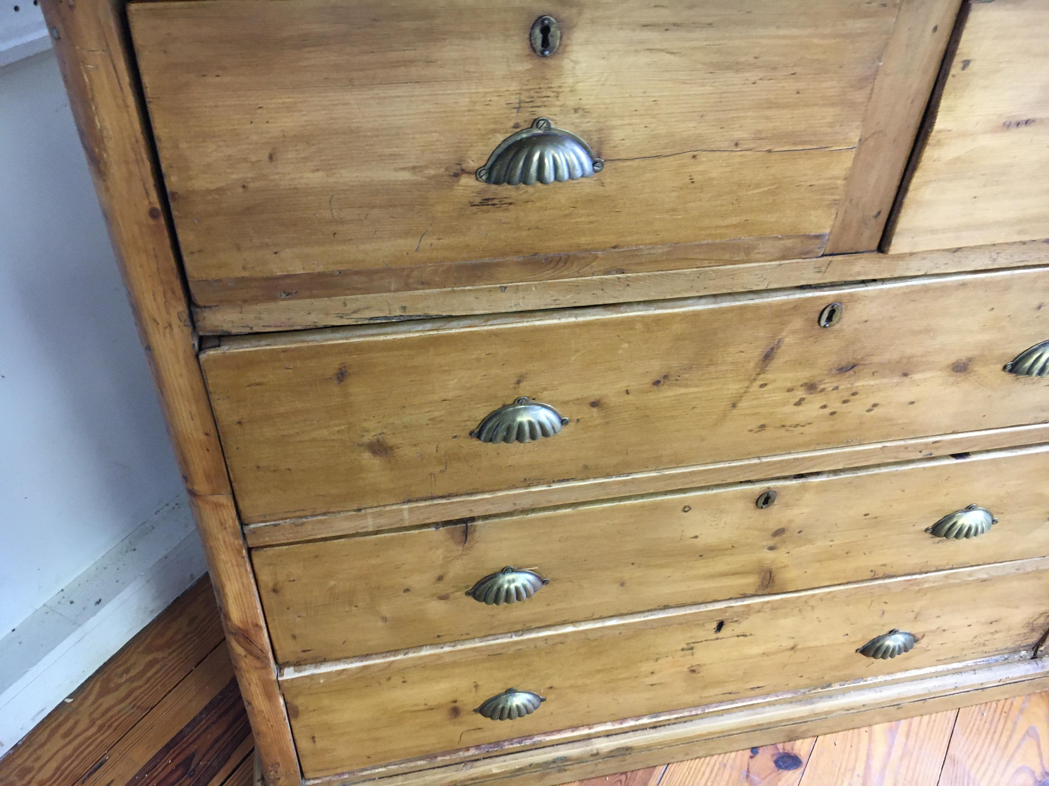 Pine - circa 1880 - We sell plenty of chest of Drawers. This one is special! With brass pulls and a great size for storage this COD has a very nice patina. Three very large drawers on the bottom and two smaller drawers on top. These drawers open and