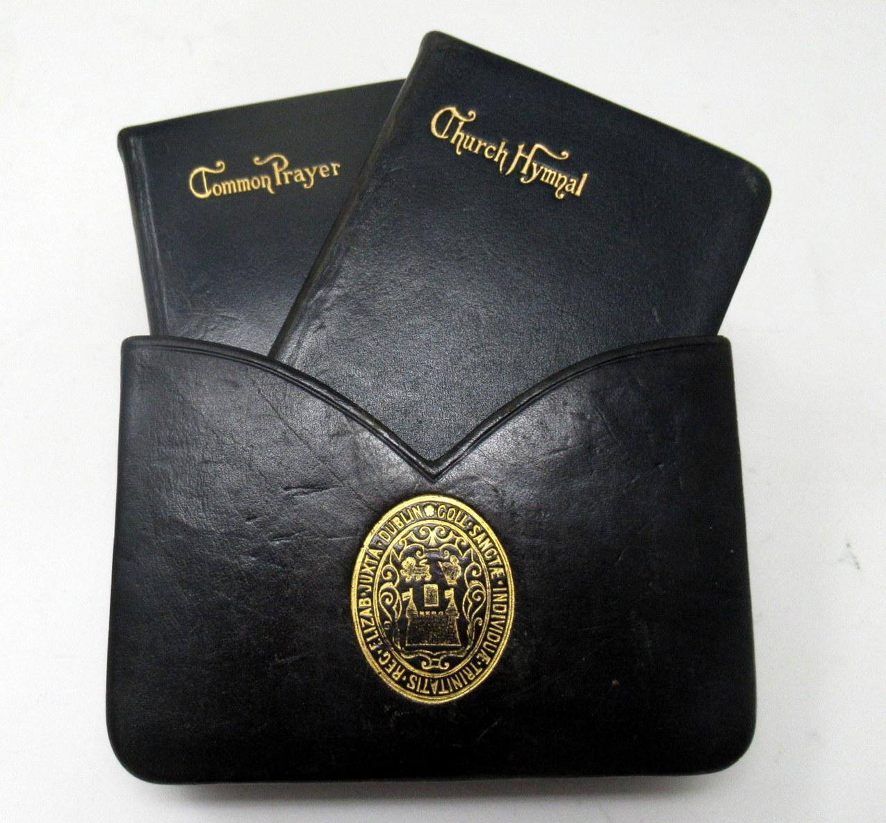 An extremely rare example of a leather-bound cased set of the book of “Common Prayer” and “Church Hymnal” enclosed within their original leather silk lined case which bears the insignia of Trinity College, Dublin, Ireland, at back and front areas.	