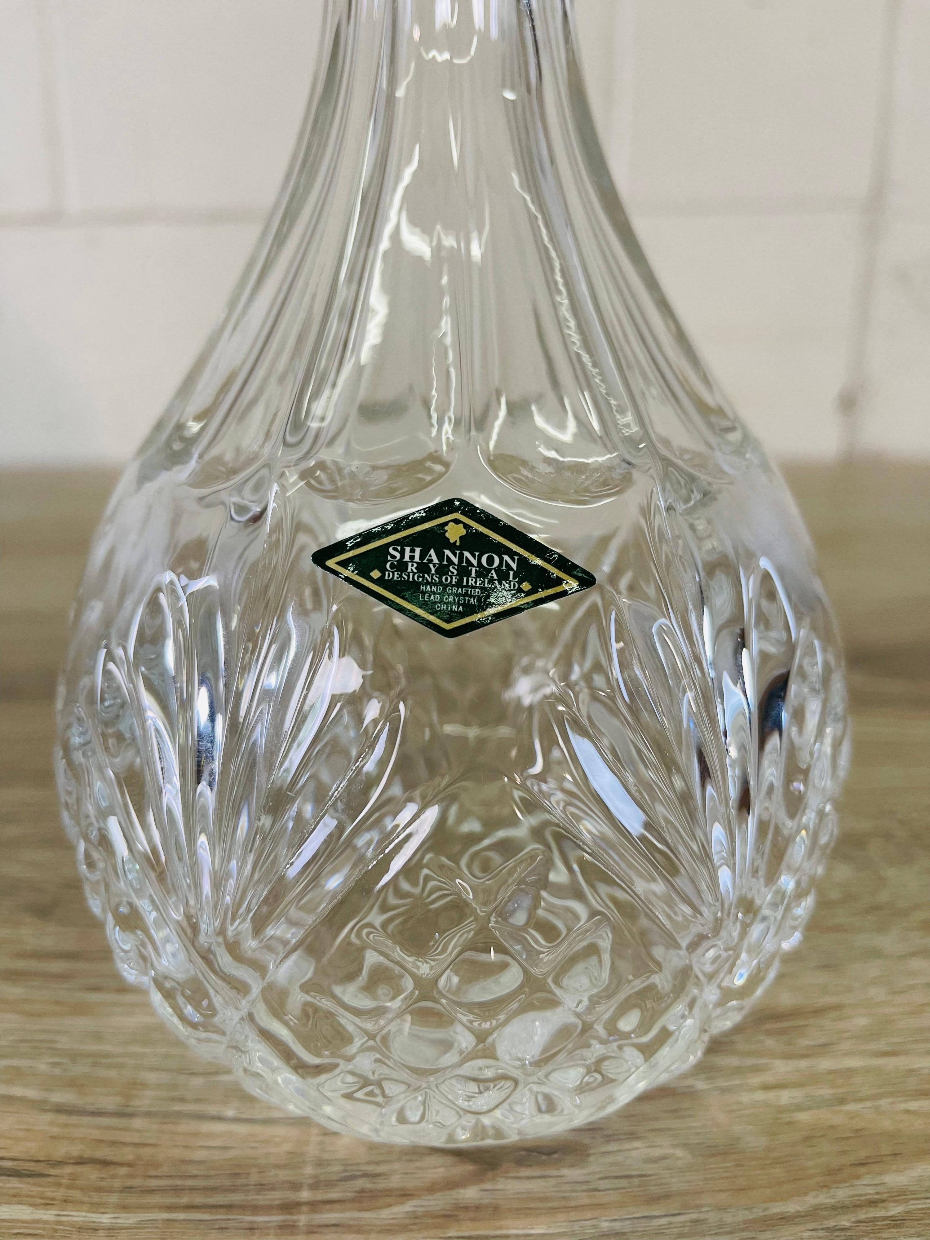 Vintage Irish crystal round glass decanter with the stopper. Marked with a label.