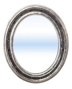 Irish Ebonized and Silver Parcel Gilt Oval Wall Mirror (H 23 1/4 x W 19 1/4)