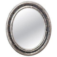 Irish Ebonized and Silver Parcel Gilt Oval Wall Mirror (H 23 1/4 x W 19 1/4)