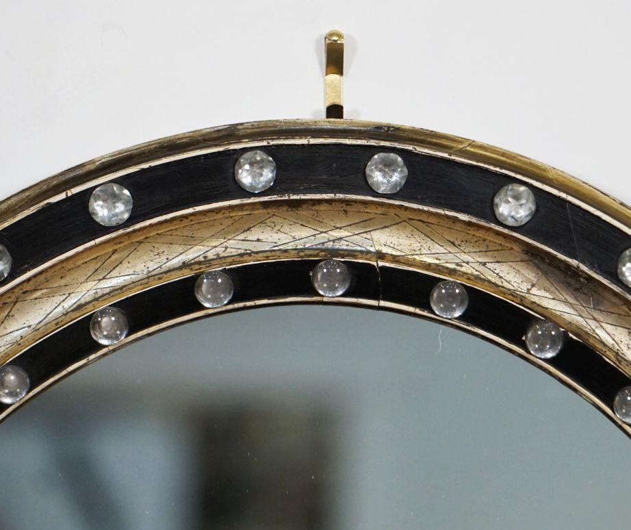 Irish Ebony and Gilt Oval Mirror with Faceted Glass Studs (H 24 3/8 x W 20 1/2)  In Good Condition For Sale In Austin, TX