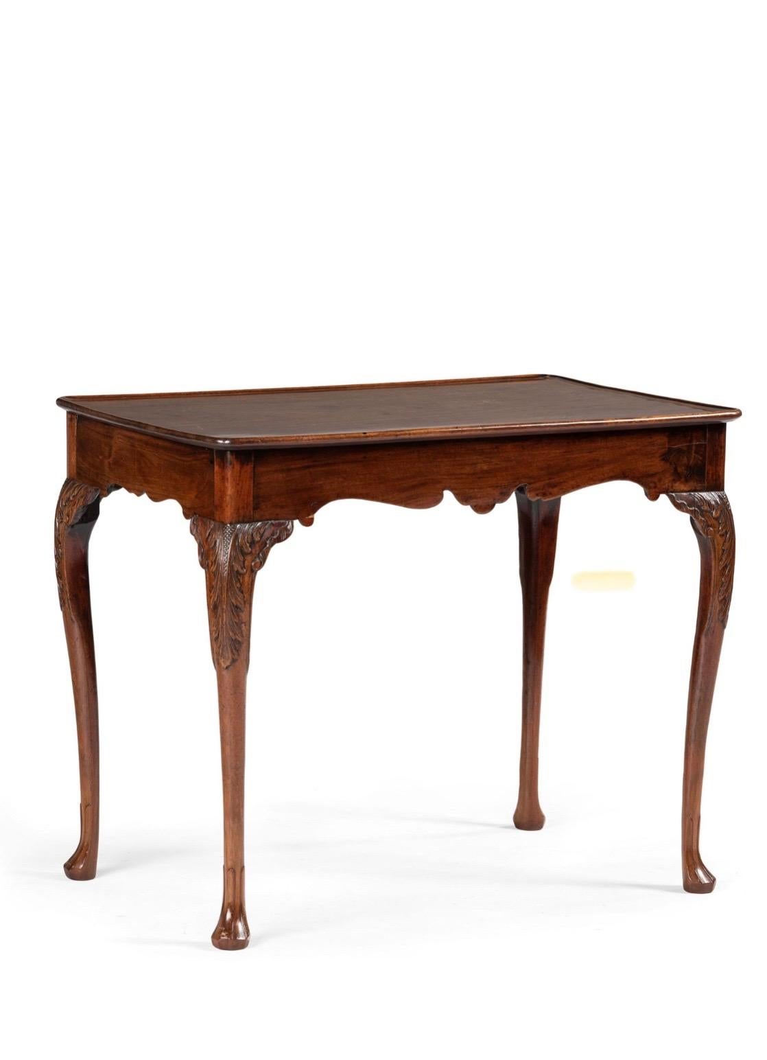 Irish George III carved mahogany dished top tea table, 18th century
Beautifully hand carved foliage, slightly curved cabriole tapered legs on padded feet. 
Old Tag from Edward Butler Antiques & Fine Art Galleries, 14 Bachelor's Walk,
