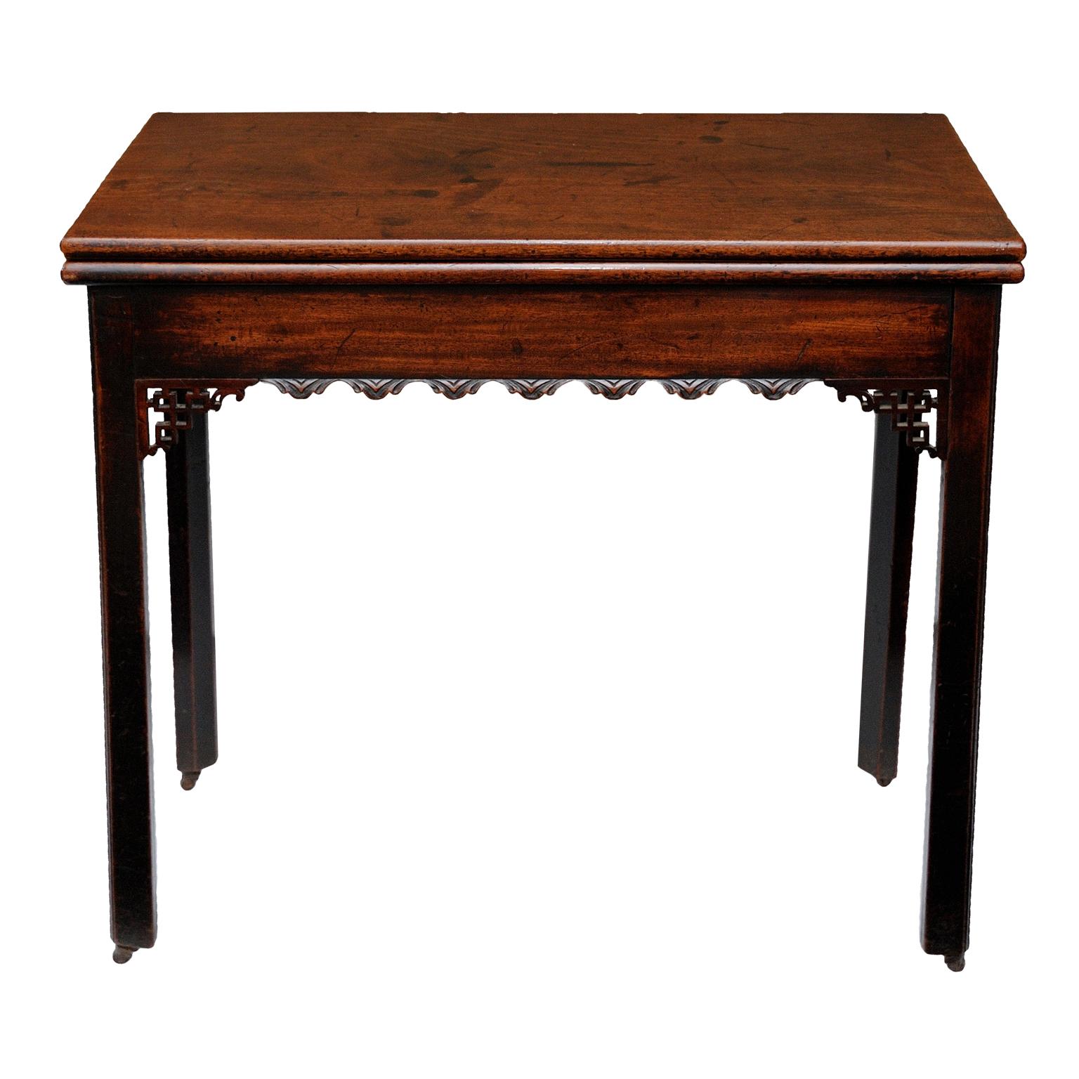 This is a rather attractive and rare Irish early George III Chippendale period mahogany Tea Table, decorated with Chinese fret spandrels and well carved frieze, complete with original castors, circa 1760. 

Measures:
Height Closed: 76cm (30
