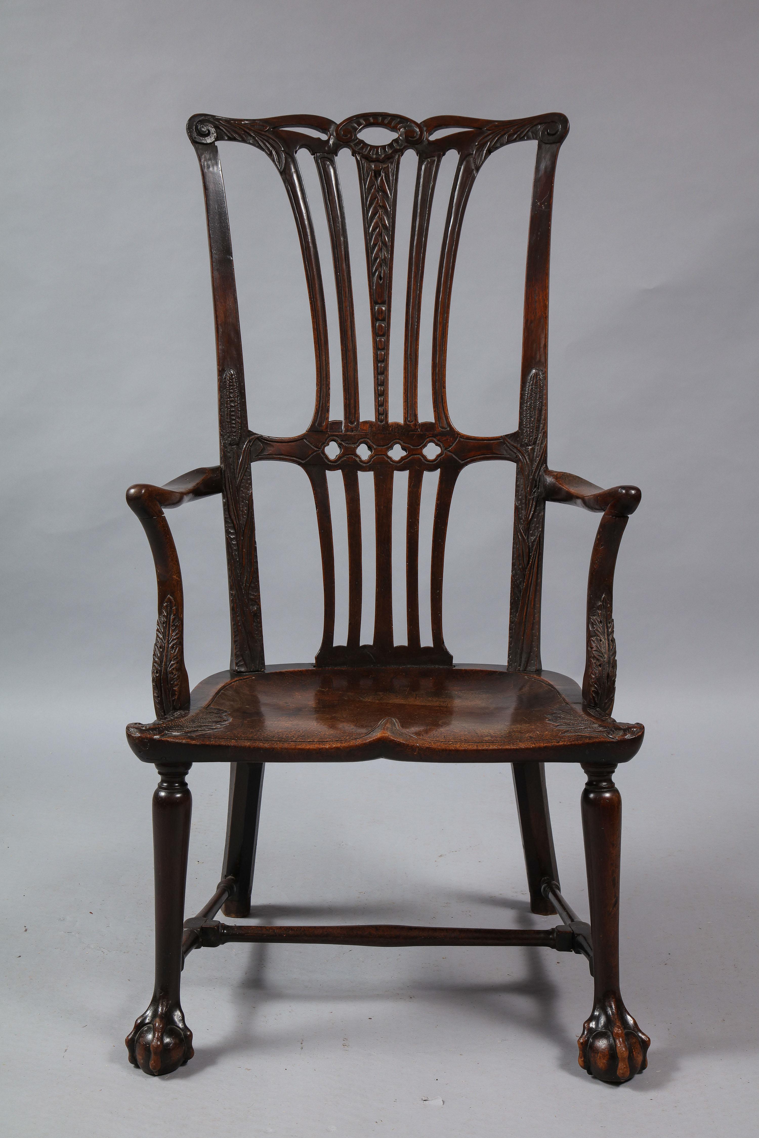 Fine 18th century Irish library Windsor mahogany armchair, the pierced crest with scroll carved ears and acanthus leaf flourishes, the central splat with quatrefoil decoration and lobed segments, the central one with leaf and bead carved details,