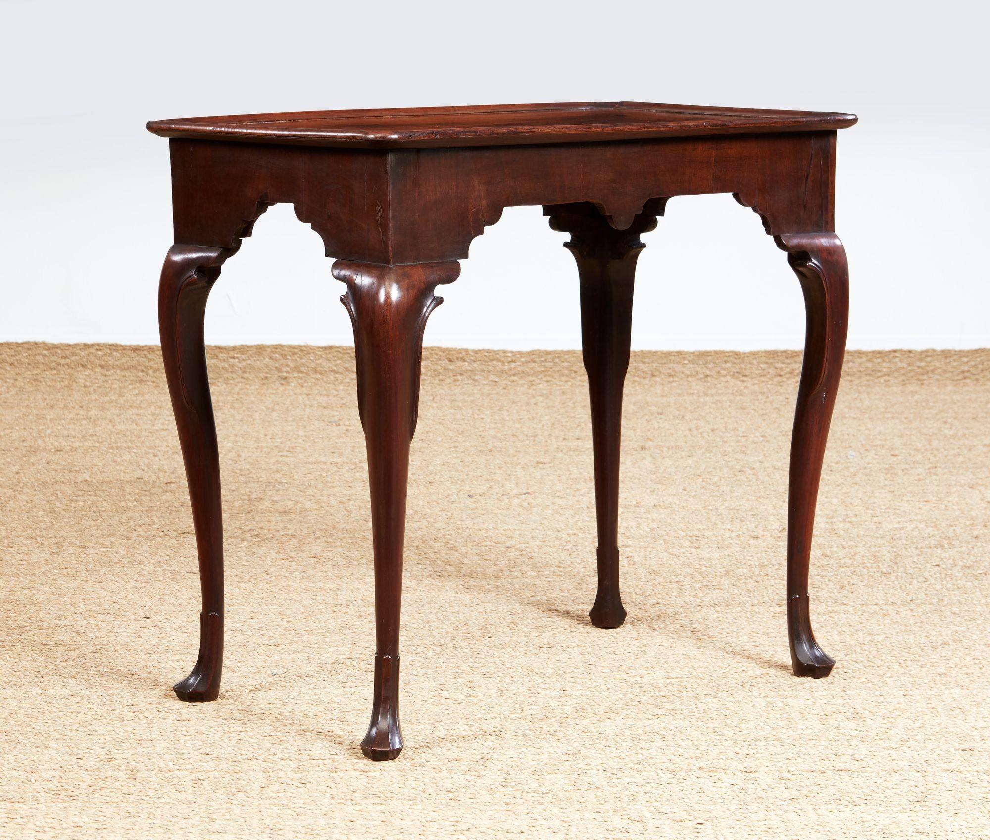 Fine Irish 18th century mahogany tea table, the well figured single plank top with dished edge over deeply scalloped apron and standing on graceful cabriole legs ending in well-formed drake feet, the whole possessing good rich color and patina.