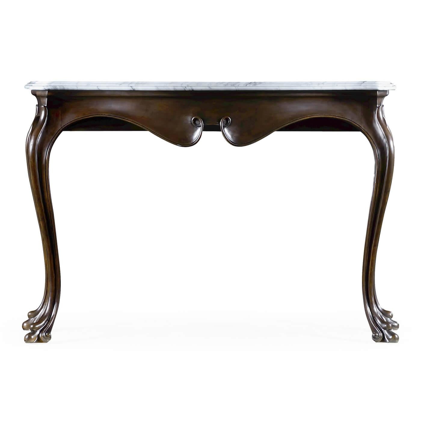 A pair of Irish Georgian dark mahogany carved serpentine form console tables with a shaped Carrara marble top, cabriole legs and carved scroll feet.

Dimensions: 51 7/8