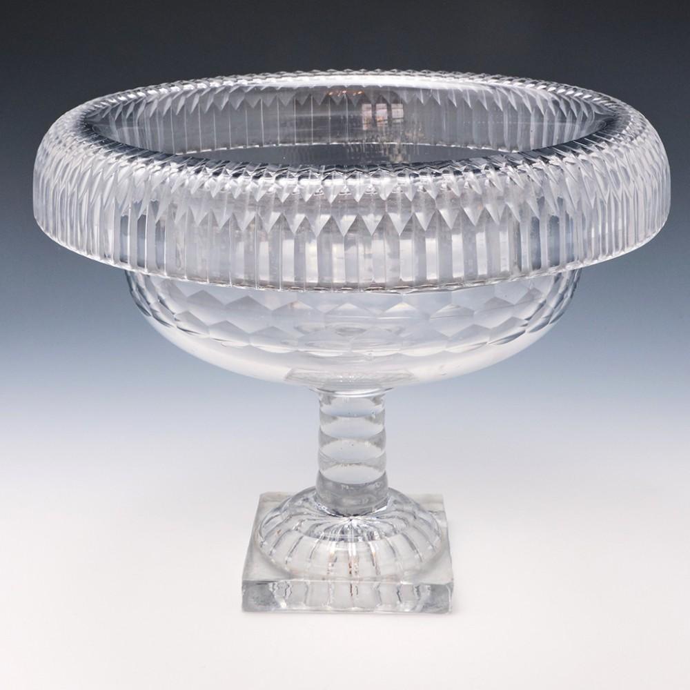 Irish Glass Fold Over Rim Pedestal Bowl, 1800-10

A Fine Irish pedestal bowl with hand blown bowl and pressed glass lemon squeezer foot.  The turned over rim bowl carries some imperfections, inclusions from the glassmaker's crucible but this is in