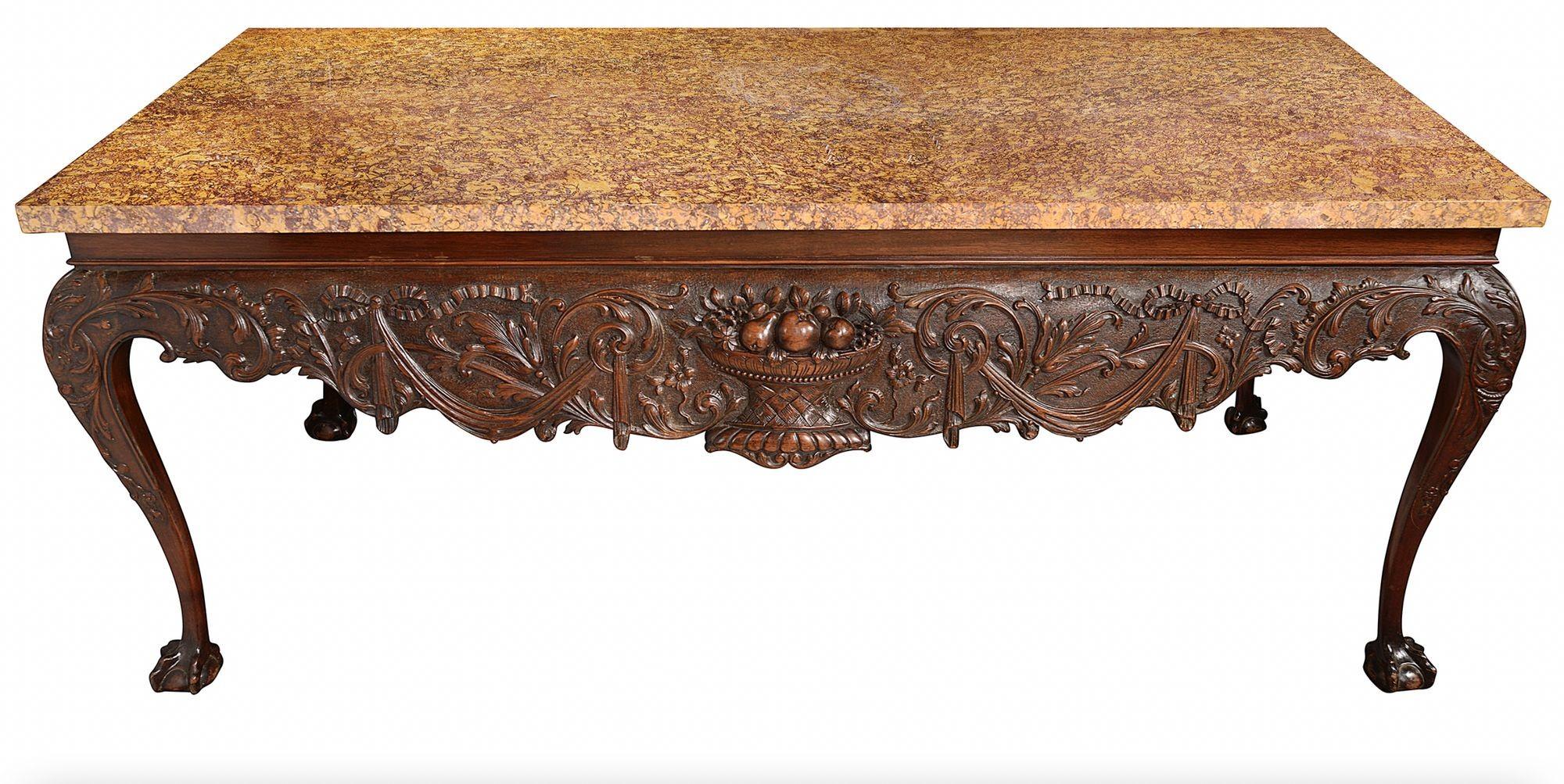 A very impressive late 19th century Irish influenced marble topped console/side table, having its original Brocatelle Jaune du jura marble top, wonderful hand carved classical foliate, ribbon and swag decoration to all four sides of the apron.