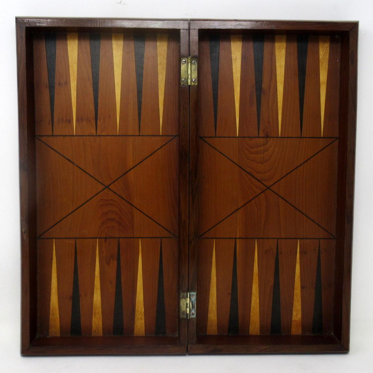 Fine Example of an Irish Killarney Ware Arbutus Wood Backgammon and Chess Board of medium proportions and folding rectangular shape, mid-19th century.

The main parquetry chess game area enclosed by an alternating border inside a plain wider
