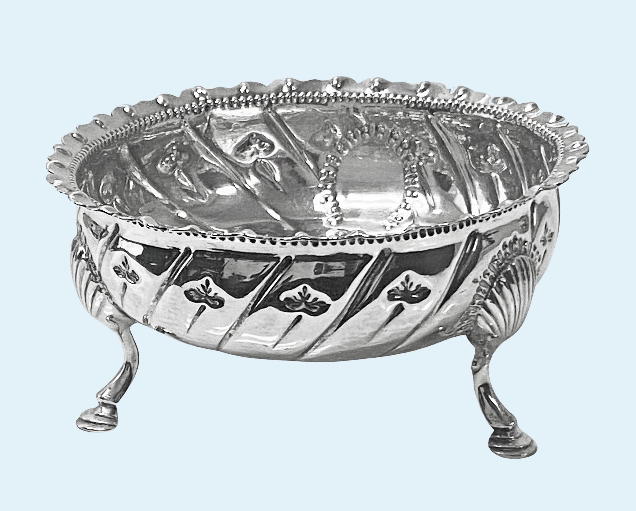 Very Rare Irish Provincial Silver Sugar Bowl, mark of John Hackett C.1780. Height: 6.35 cm Width: 12.7 cm. Weight: 168 grams. Condition: Very good. The swirl fluted body with wavy crimped everted rim and small foliate interval decoration, raised on