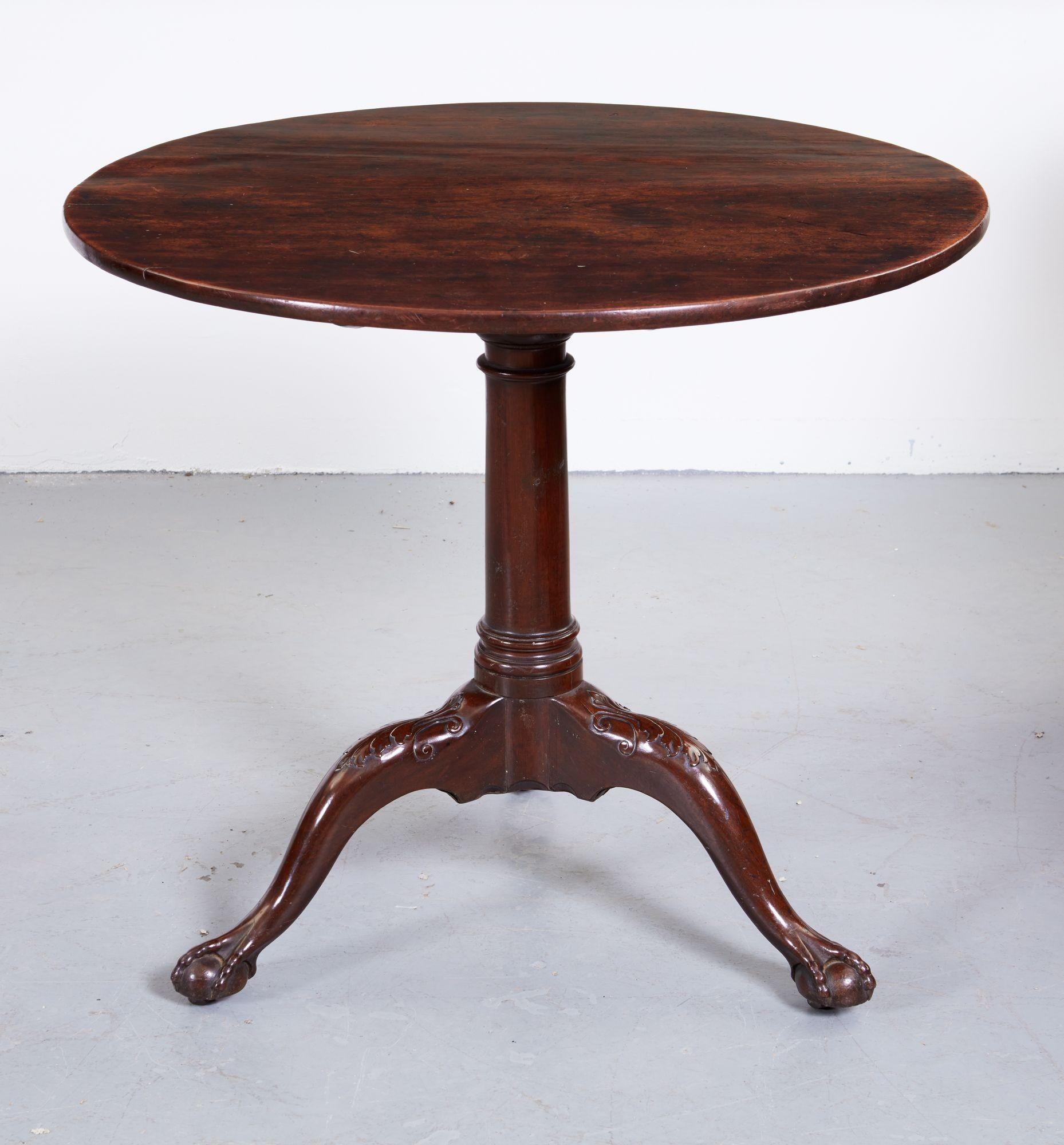 Good 18th century Cuban mahogany tilt-top tea table, the single plank top with rich graining, over cannon barrel turned shaft, over acanthus leaf carved cabriole legs ending in ball and claw feet, the whole with good rich color and patination.