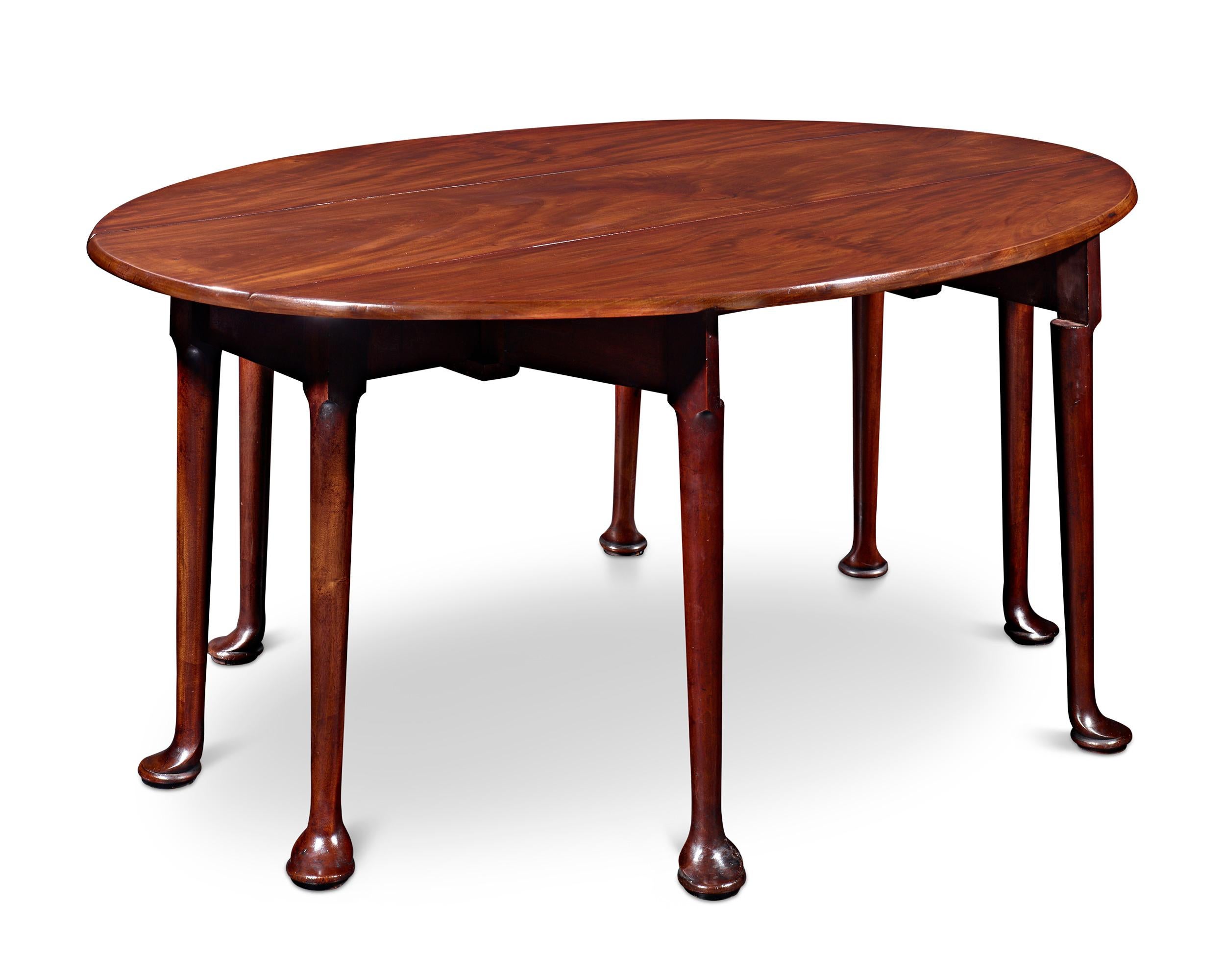 Both outstanding design and rich tradition set apart this intriguing Irish mahogany table. Often referred to as a “wake” table, this extra-long oval table would have once been used year-round as a dining table. Yet, it also served as the focal