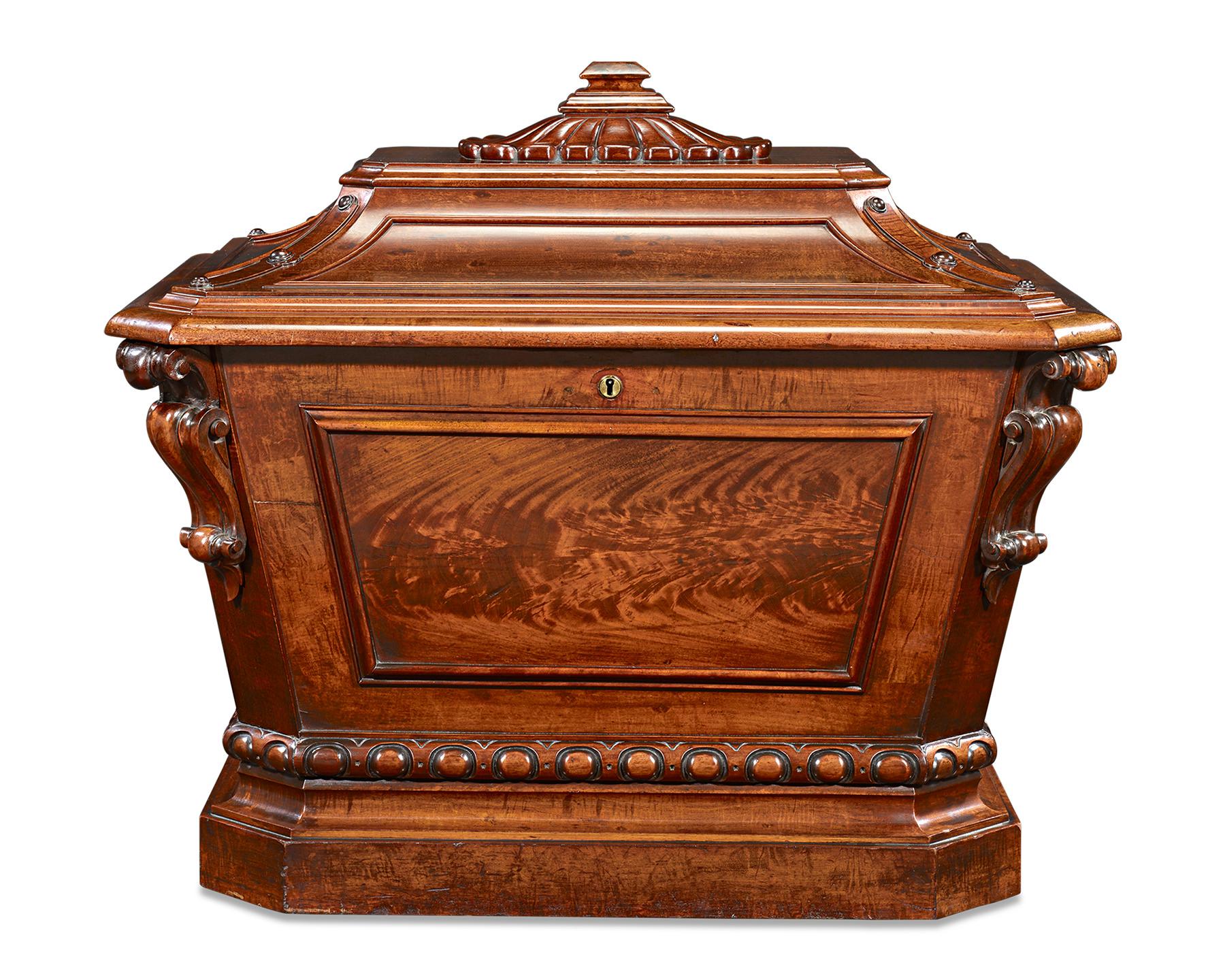 This rare William IV-era Irish sarcophagus wine cellarette, or cooler, is crafted of rich mahogany. Exhibiting beautifully carved details, this cellarette is a marvel of Neoclassical artistry. As practical as it is beautiful, the cooler features 18