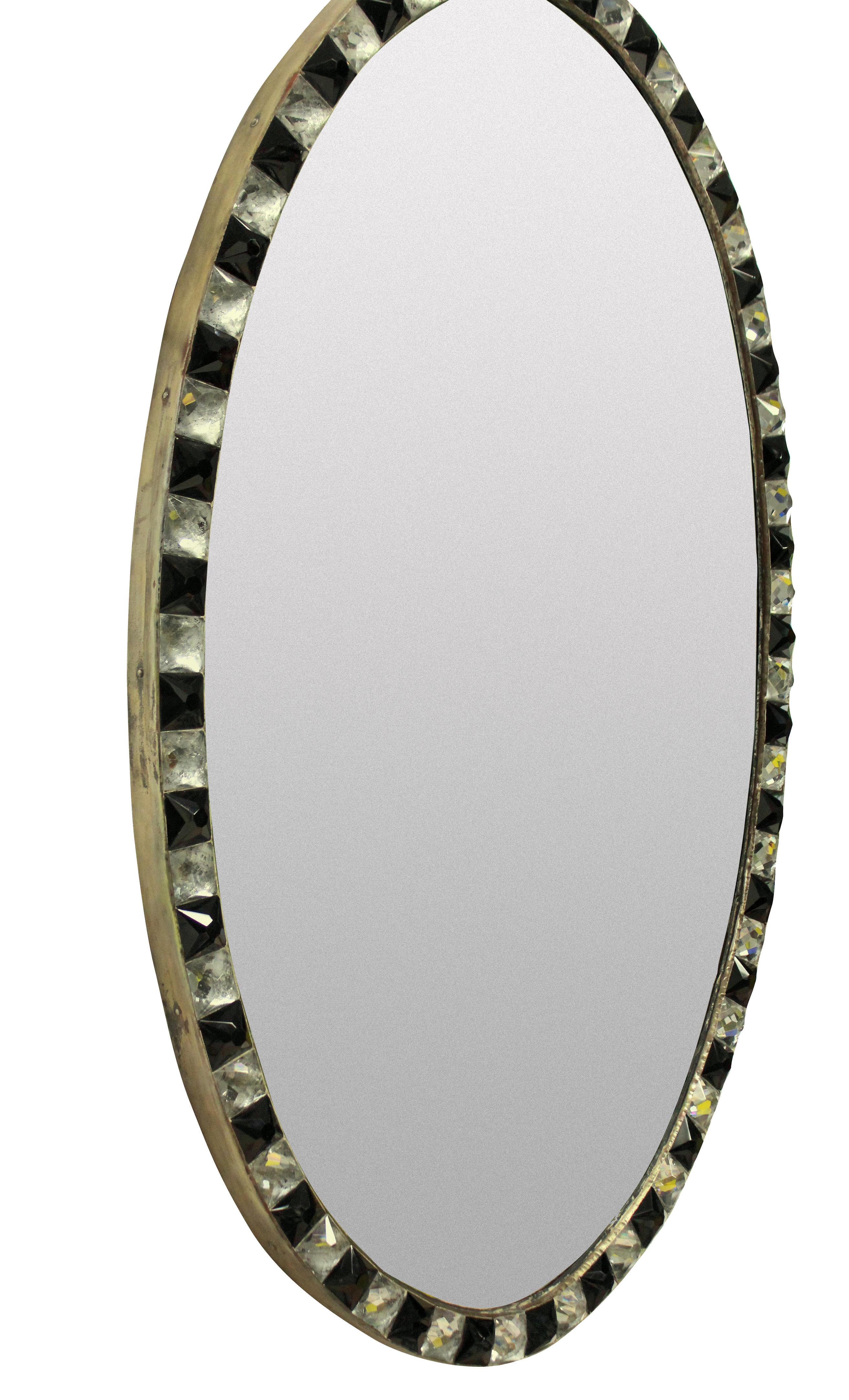An Irish mirror in the George III style, of good quality with a faux mercury glass mirror plate pinned into a patinated copper frame, bordered with rock crystal and black glass faceted studs in the traditional 18th century manner. Of good weight and