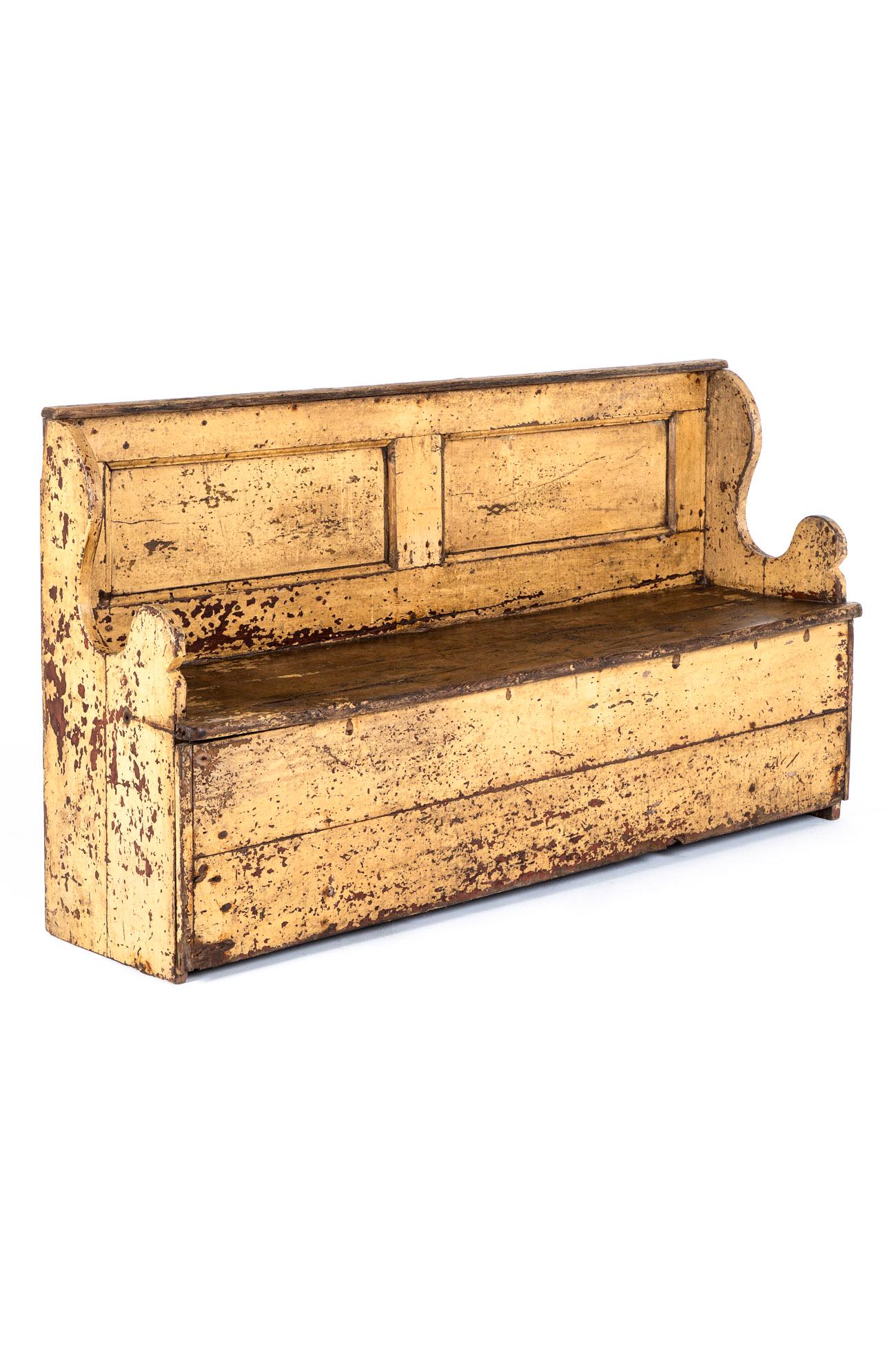 A charming early 19th century primitive Irish settle in original untouched condition.

The whole piece is made from substantial sections of solid pitch pine offering a split panelled back supported by carved shapely slab end supports.

Presented in