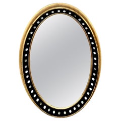 Irish Regency Style Oval Mirror with Parcel Gilt Frame and Glass Cabochons