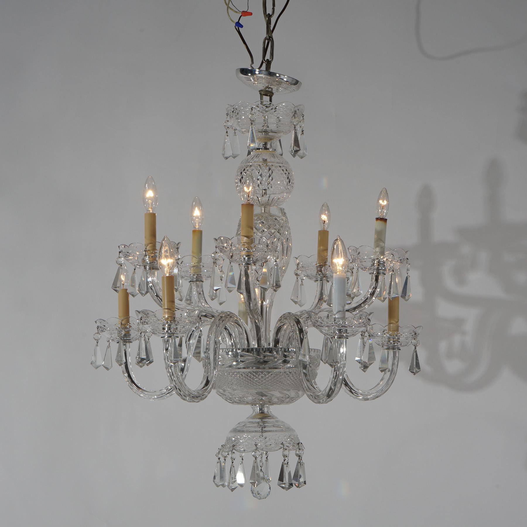 A Waterford chandelier offers cut crystal bodice with eight scroll form arms terminating in candle lights; cut crystals throughout; 20th century

Measures - 33