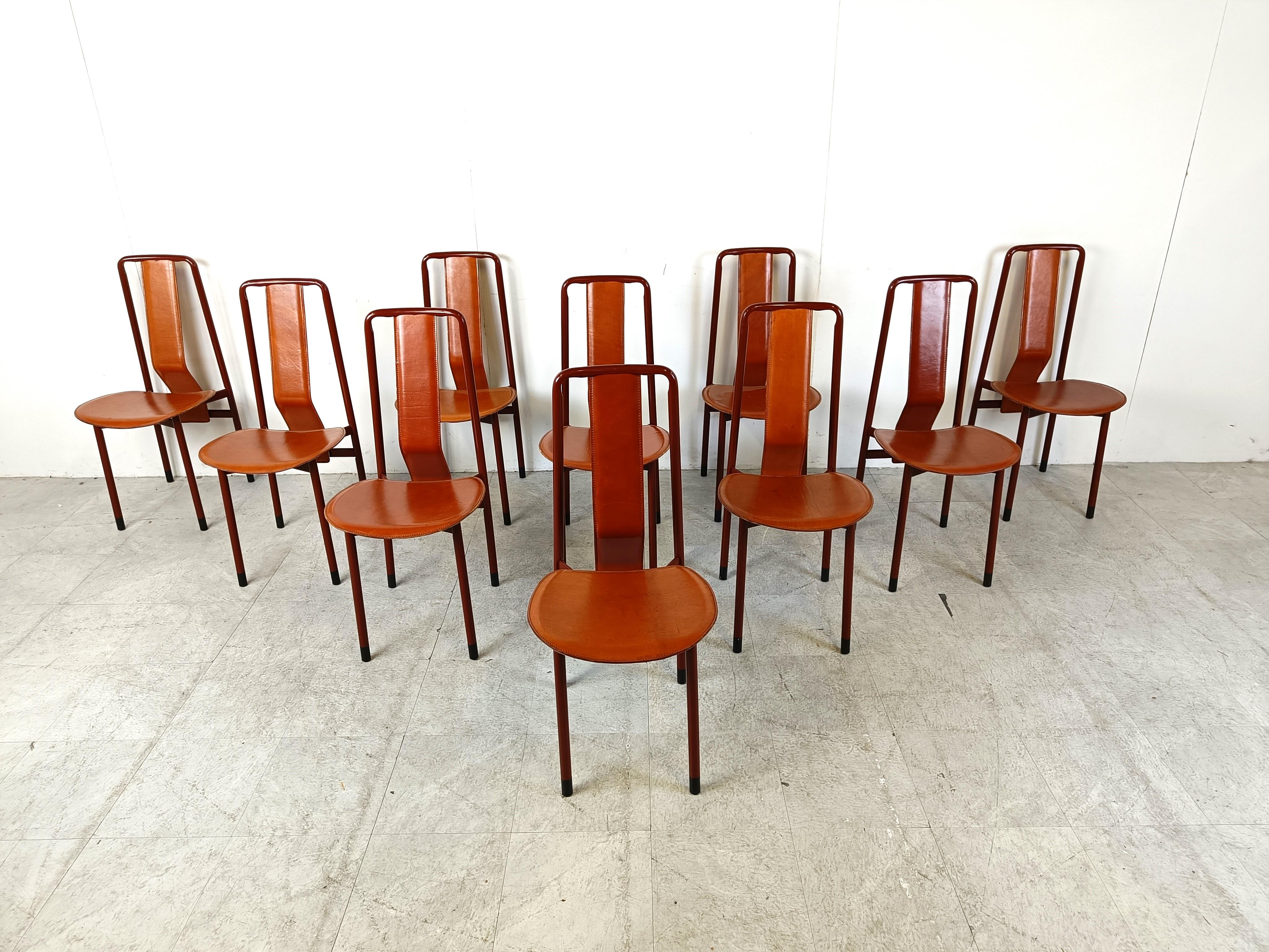 Vintage design dining chairs designed by Achille Castiglioni for Zanotta model Irma.

Red lacquered metal frames with leather seats and backrests. 

In good condition with normal age related wear. 

No rips or scratches in the leather.

1970s -