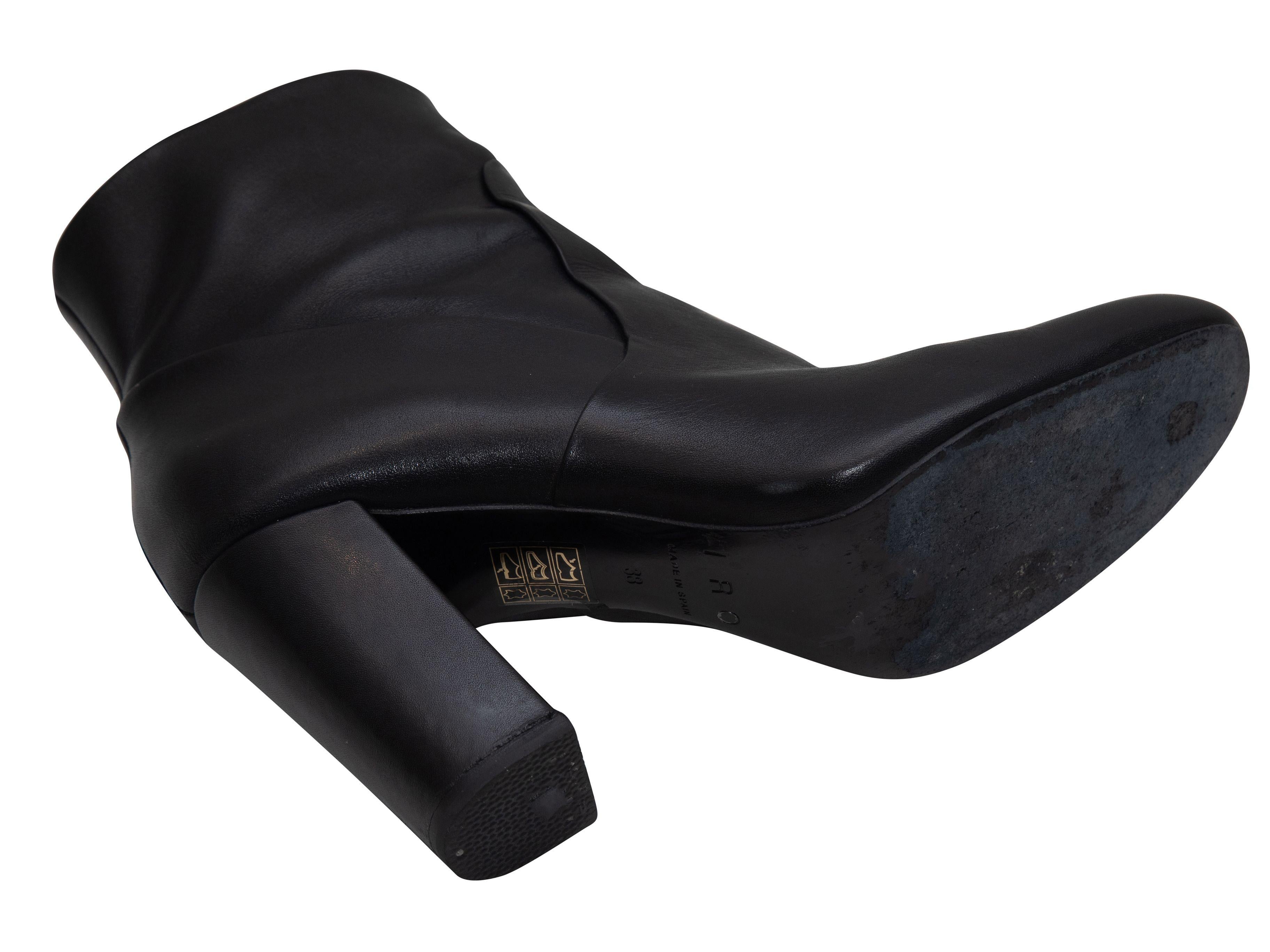 Product Details: Black leather heeled ankle boots by Iro. Block heels. Zip closures at inner sides. 3.5