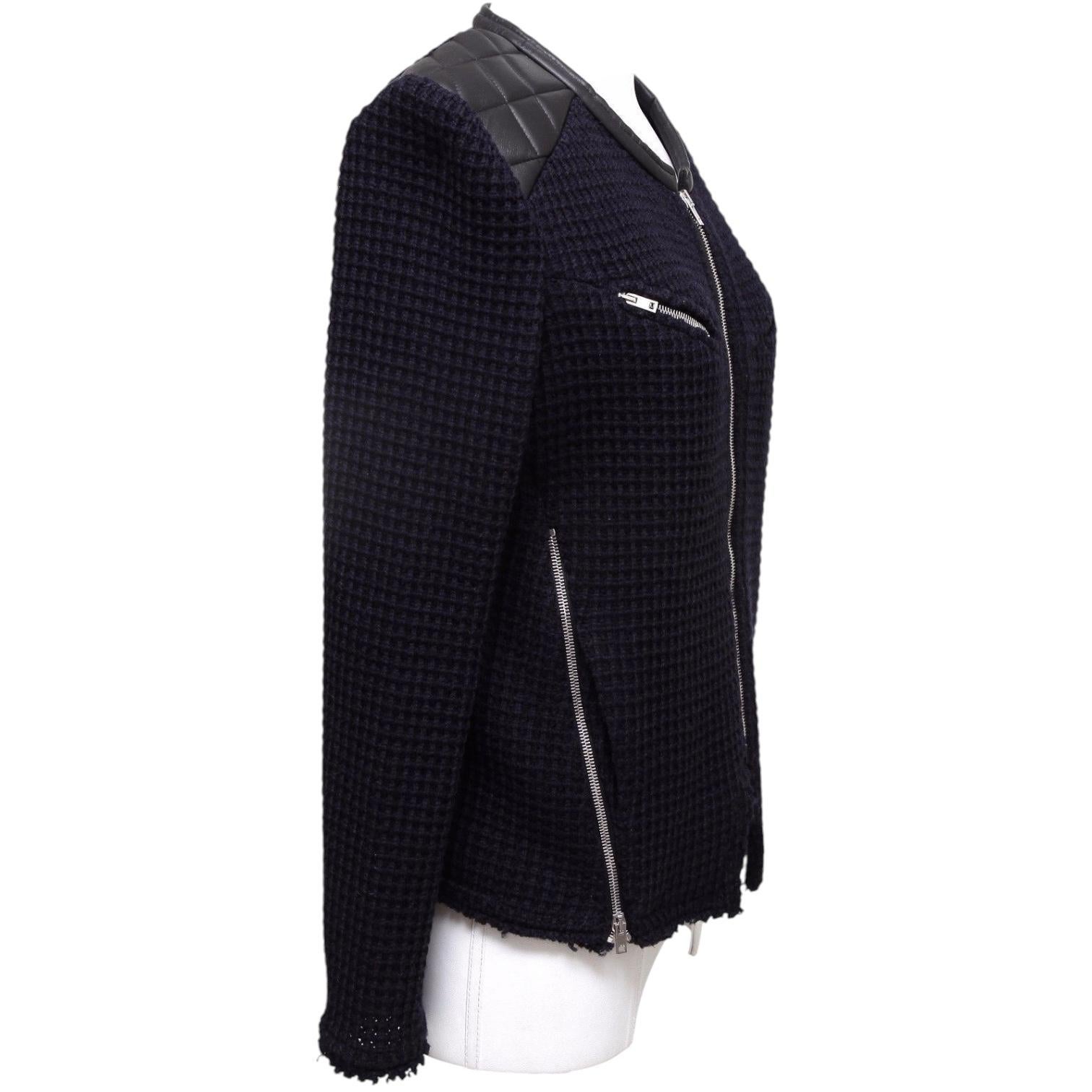 GUARANTEED AUTHENTIC IRO CEYLON LEATHER TRIMMED KNIT JACKET

     Design:
     • IRO CEYLON knit jacket in midnight blue.
     • Black quilted leather at shoulders, collar and side interior lining of front zipper closure.
     • Dual zip pockets at