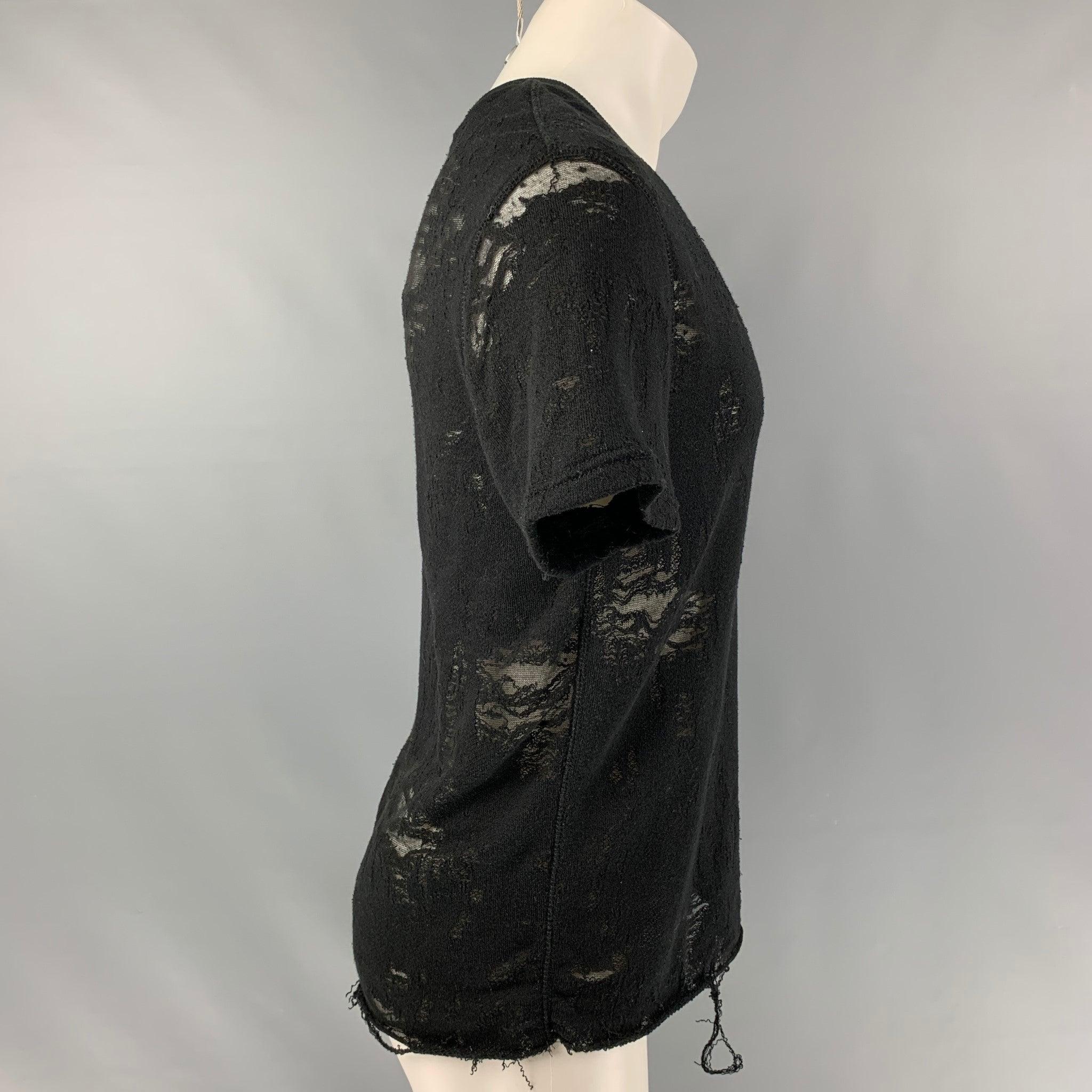 IRO JEANS Gaetane T-shirt comes in a black partially see through cotton blend jersey featuring a distressed style and crew-neck. Very Good Pre-Owned Condition. Fabric Tags Removed. 

Marked:   XS 

Measurements: 
 
Shoulder: 18.5 inches Sleeves: 9