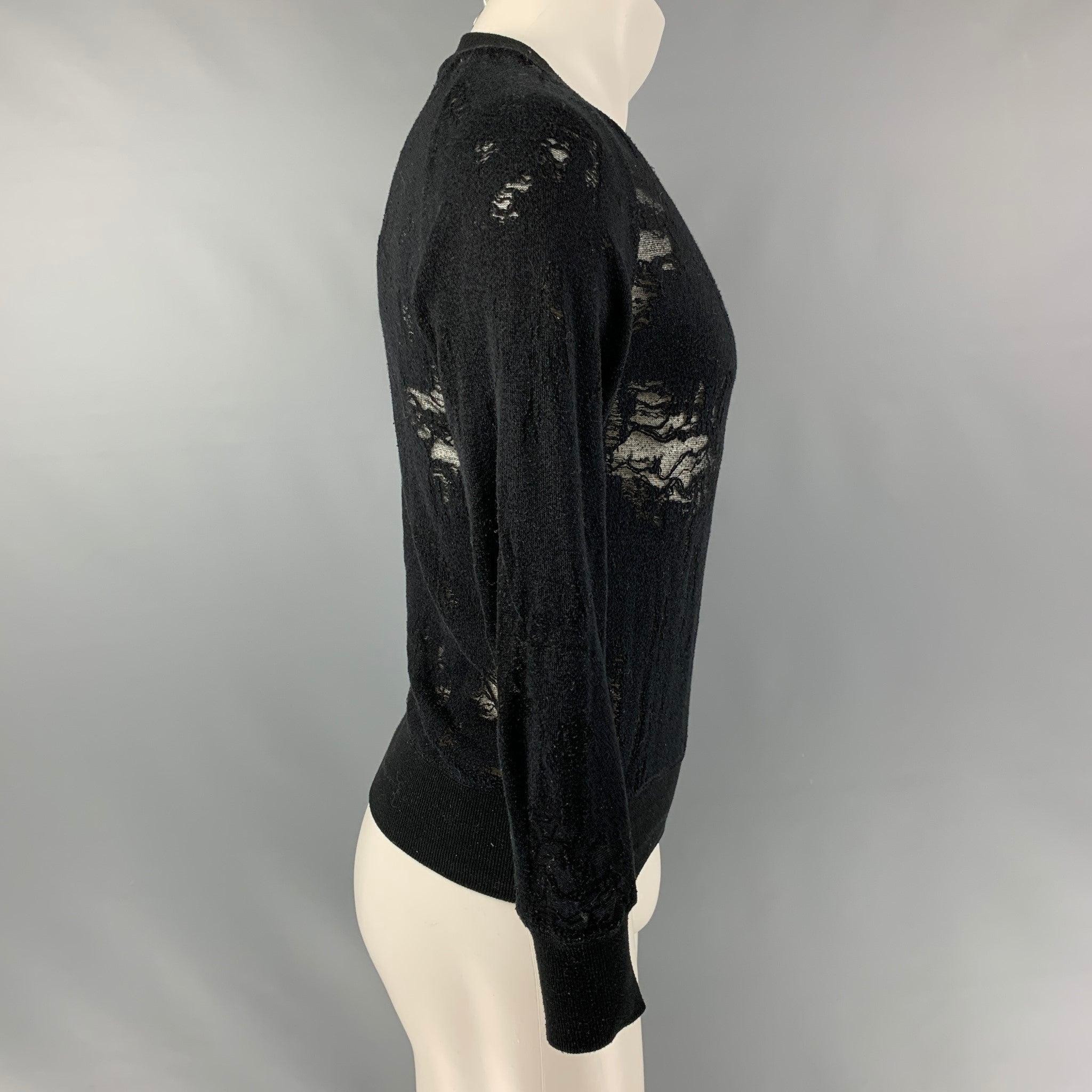IRO JEANS Nona raglan long sleeve pullover comes in a black partially see through cotton blend jersey featuring a distressed style and crew-neck. Excellent Pre-Owned Condition.  

Marked:   XS 

Measurements: 
 
Shoulder: 16 inches Sleeves: 23