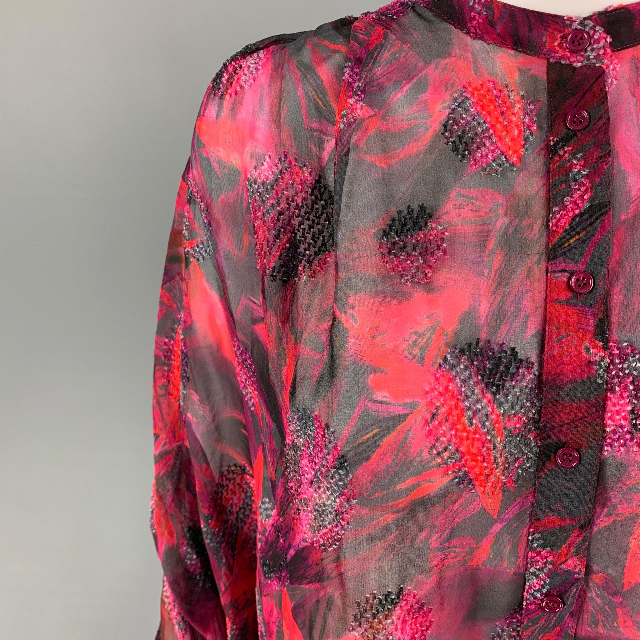 IRO blouse comes in a red & black textured silk / viscose featuring a oversized fit, ruched shoulders, and a buttoned closure.
Excellent
Pre-Owned Condition. 

Marked:   21W 

Measurements: 
 
Shoulder: 18 inches Bust: 54 inches Sleeve:
22 inches