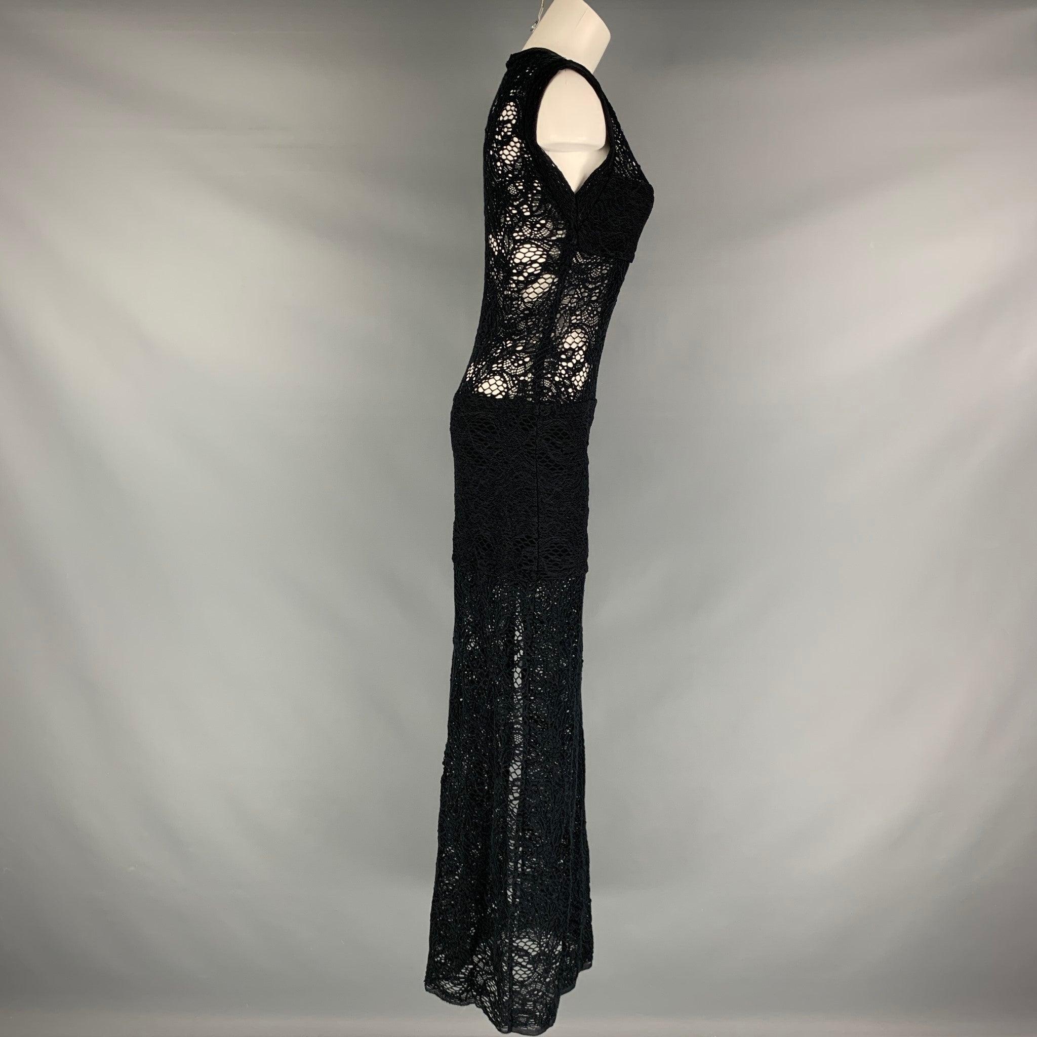 IRO long dress comes in a black cotton blend knit material featuring a sleeveless shift dress style, side slit, and lace texture. Very Good Pre-Owned Condition. 

Marked:  40 

Measurements: 
 
Shoulder: 15 inches Bust: 33 inches Hip: 34.5 inches