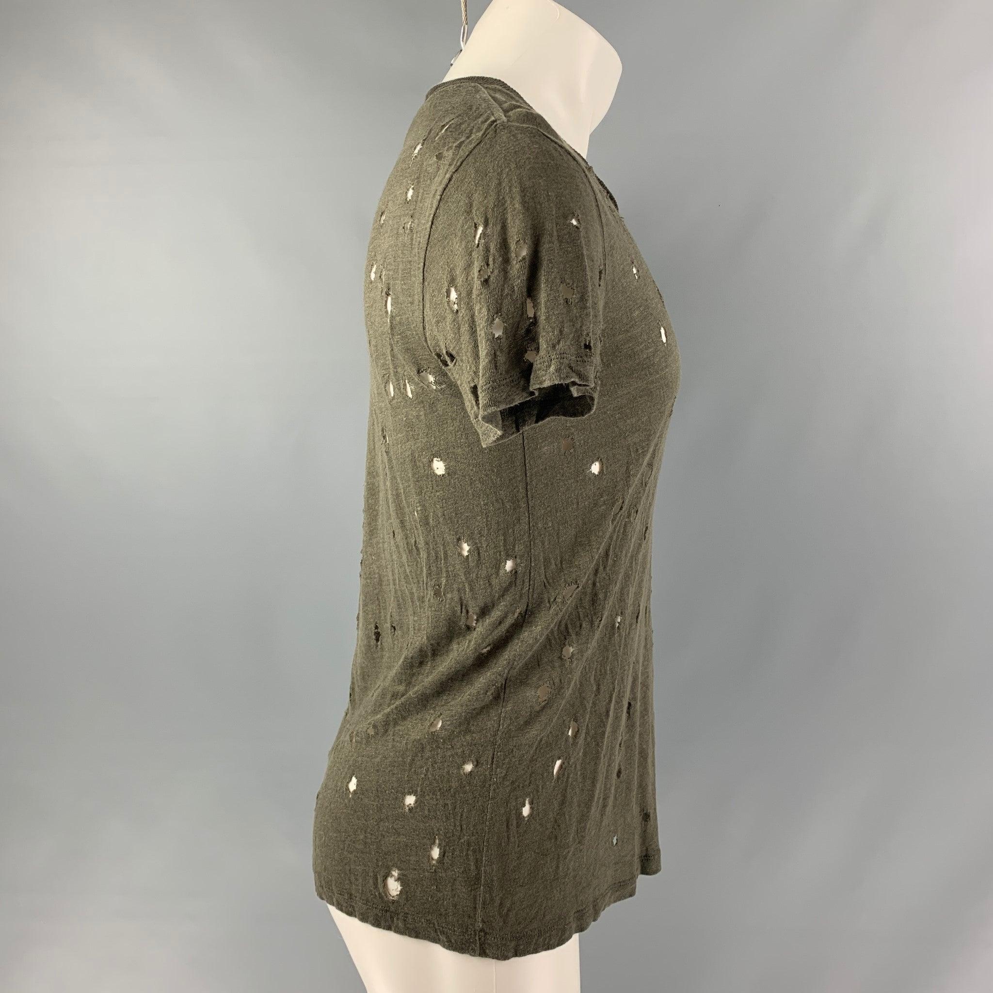 IRO 'Clay' t-shirt comes in a olive linen featuring distressed details throughout and a crew-neck. Made in Portugal. Very Good Pre-Owned Condition. 

Marked:   XS 

Measurements: 
 
Shoulder: 18 inches Chest: 46 inches Sleeve: 8 inches Length: 26.5