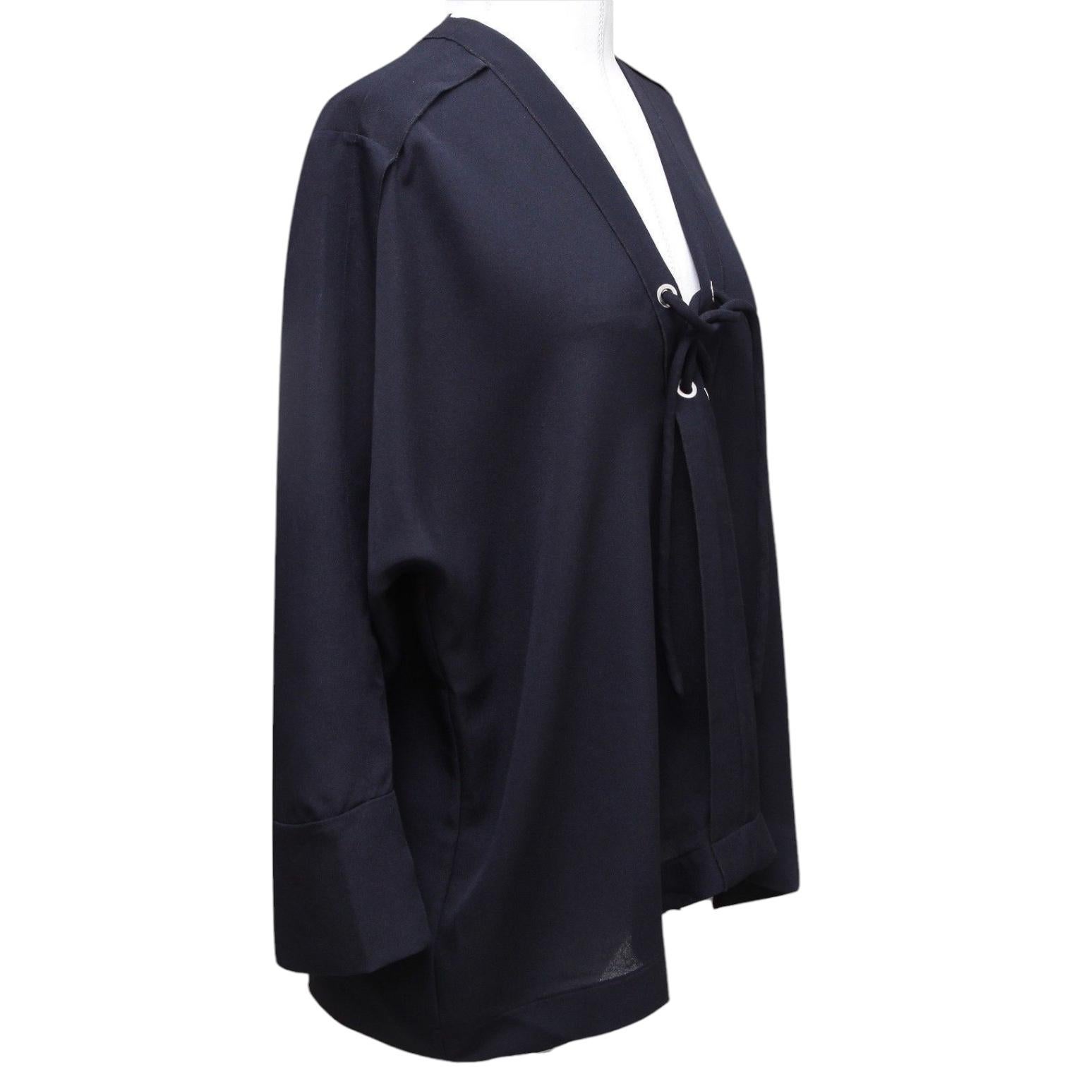 GUARANTEED AUTHENTIC IRO DARK NAVY SHEER LACE-UP BLOUSE

Design:
 • Loose fitting 3/4 sleeve (may hit wrist) tunic blouse in a deep navy blue color.
 • Lace-up front, v-neckline.
 • Paneling, rounded shoulders, loose sleeves.
 • Unlined.

Size: