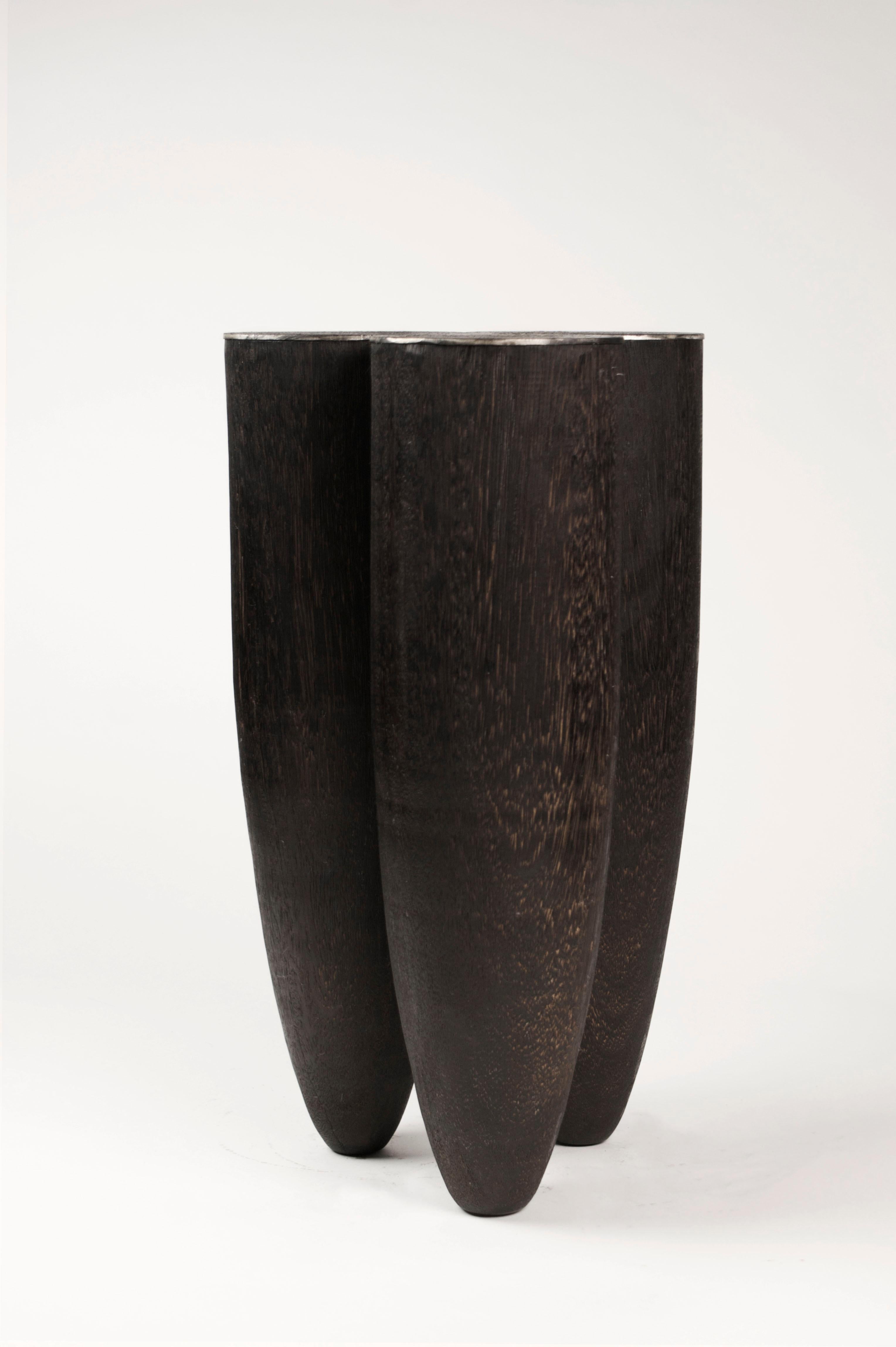 Senufo stool
Stool or side table
Measures: 50 cm H x 30 cm W, 17.9” H x 11.8” W.
Iroko wood and burned steel
Signed by Arno Declercq.

Arno Declercq
Belgian designer and art dealer who makes bespoke objects with passion for design,