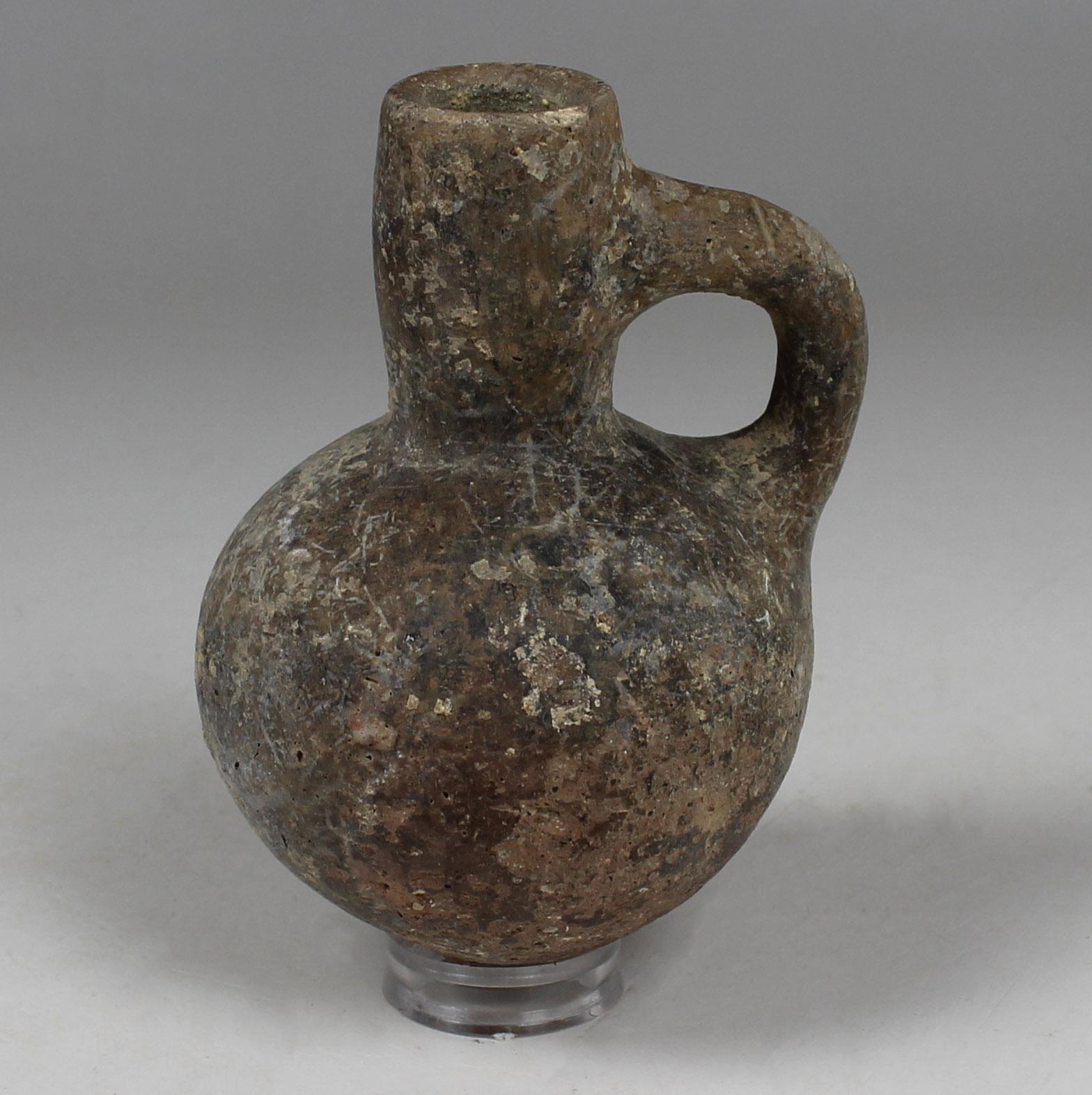 ITEM: Black juglet
MATERIAL: Pottery
CULTURE: Iron Age
PERIOD: 700 – 586 B.C
DIMENSIONS: 95 mm x 67 mm
CONDITION: Good condition
PROVENANCE: Ex Jerusalem private collection, acquired between 1975 – 1990.
PARALLEL: AMIRAN, R., Ancient Pottery of the