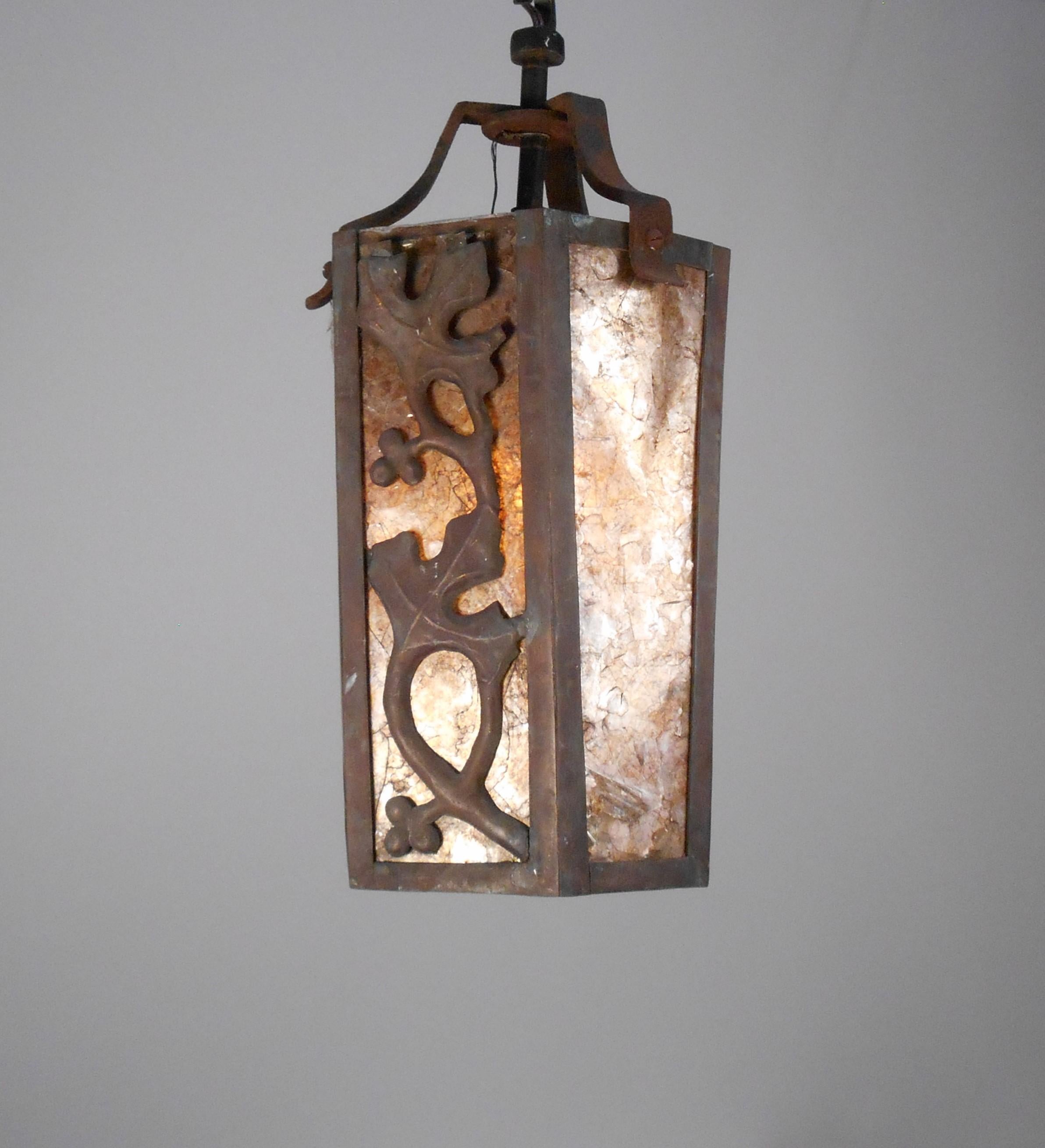 Period arts and crafts iron and original amber mica lantern. 
Wired with 5 feet of electrical cord, and comes with 3 feet of antique brass chain and bronze canopy.

Arts and Crafts and Prairie Style electric lighting fixtures are unique