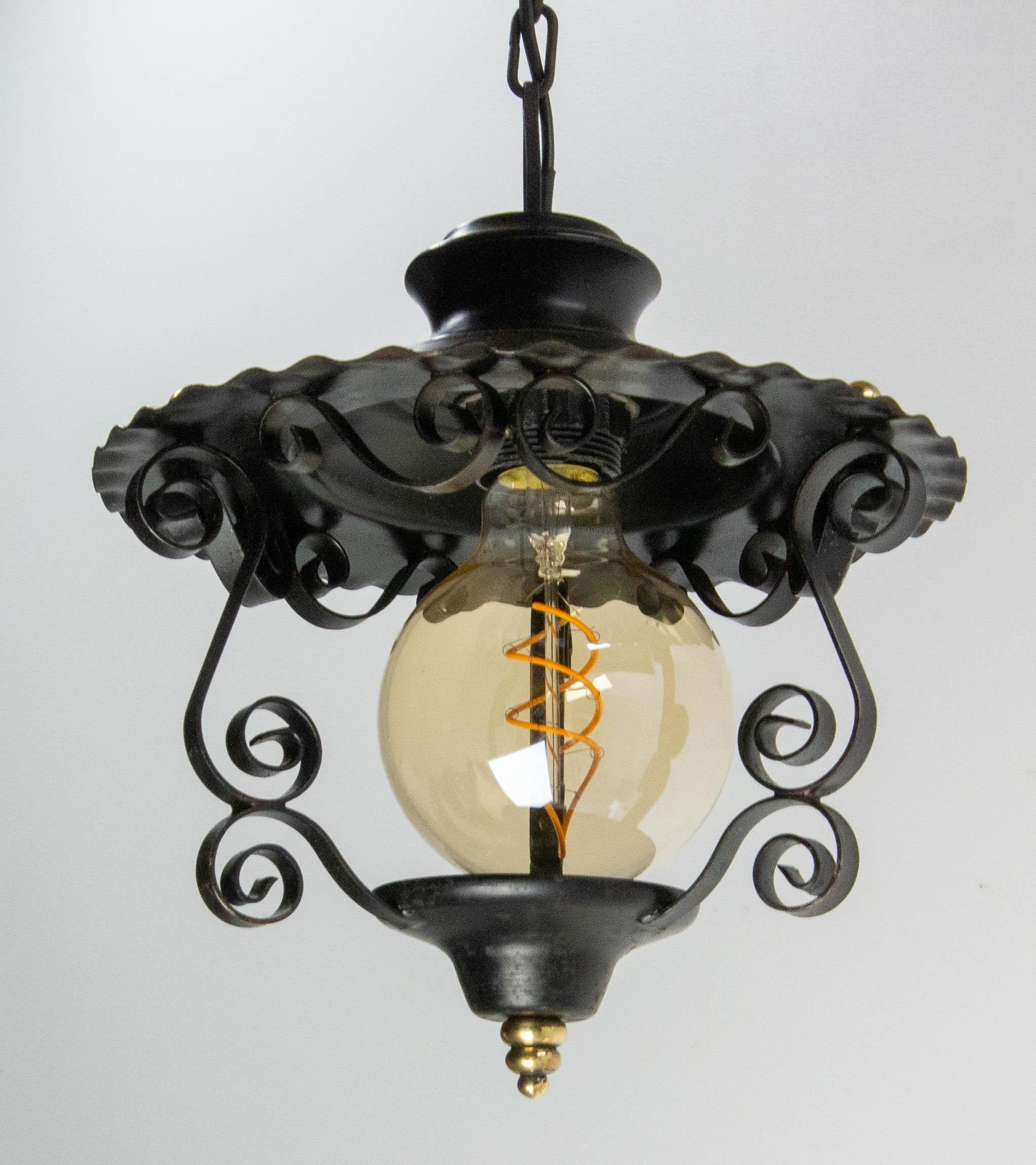 Pendant light chandelier, France, midcentury
Iron and brass. 
This lamp from the 60s has been brought up to date with a recently created bulb.
This can be rewired to USA, UK and European standards.
Good condition.

Shipping
D 19 H 19 0.7